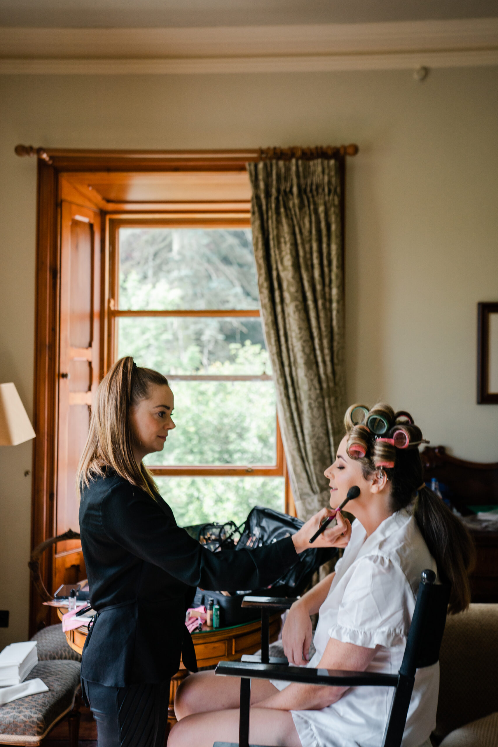 A person cutting another woman's hair