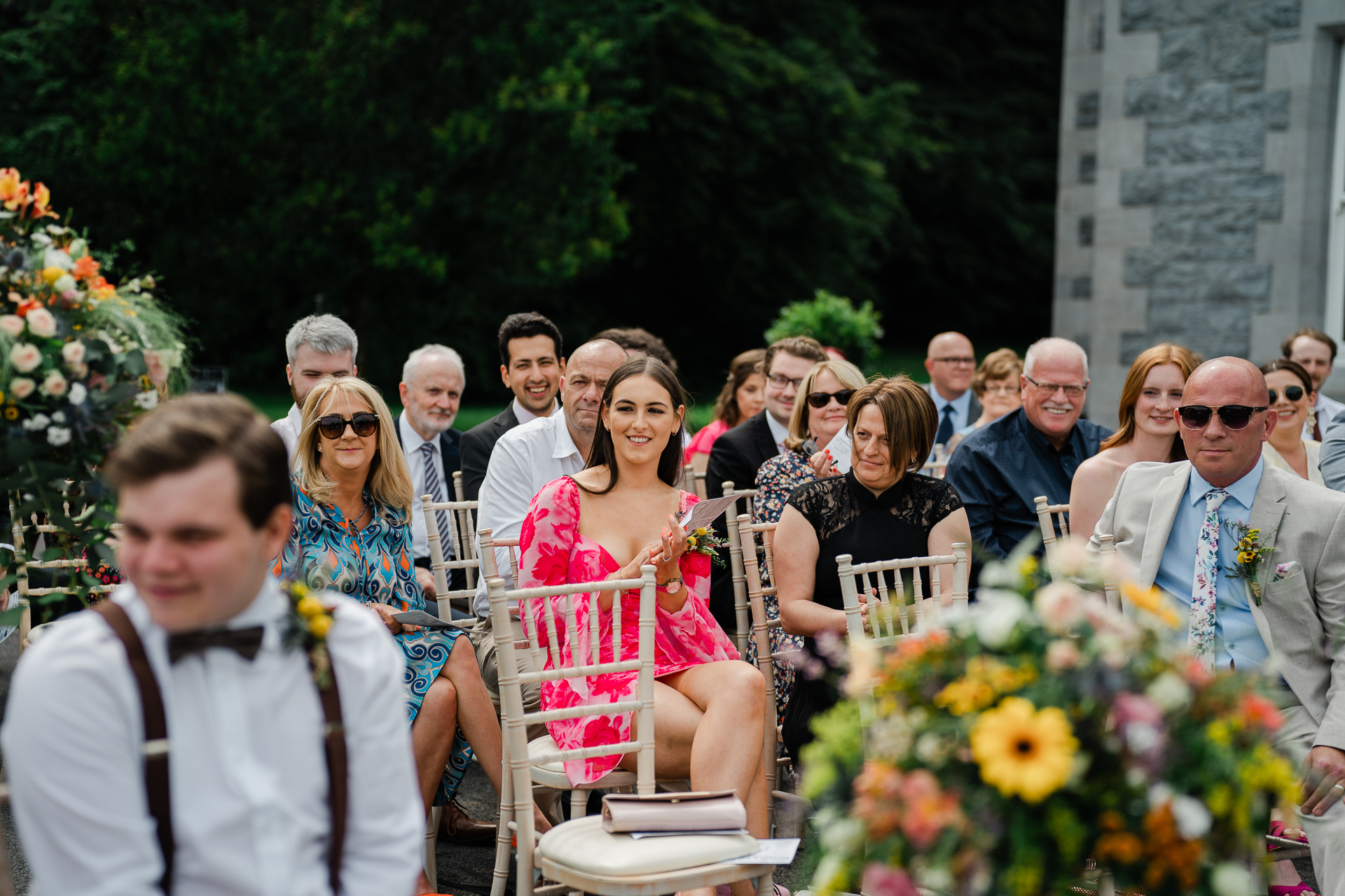 A group of people sitting outside