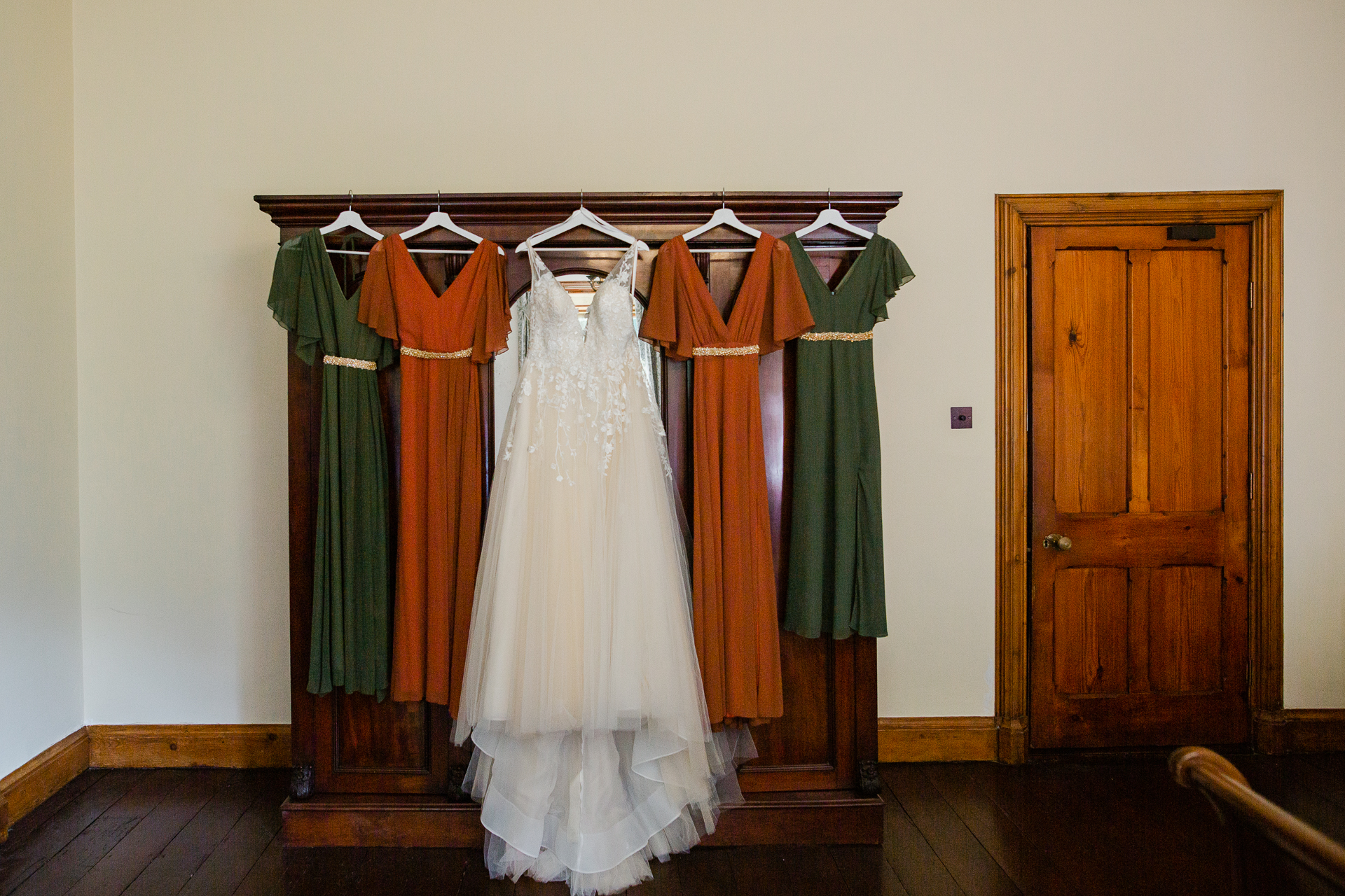 A group of dresses on a wall