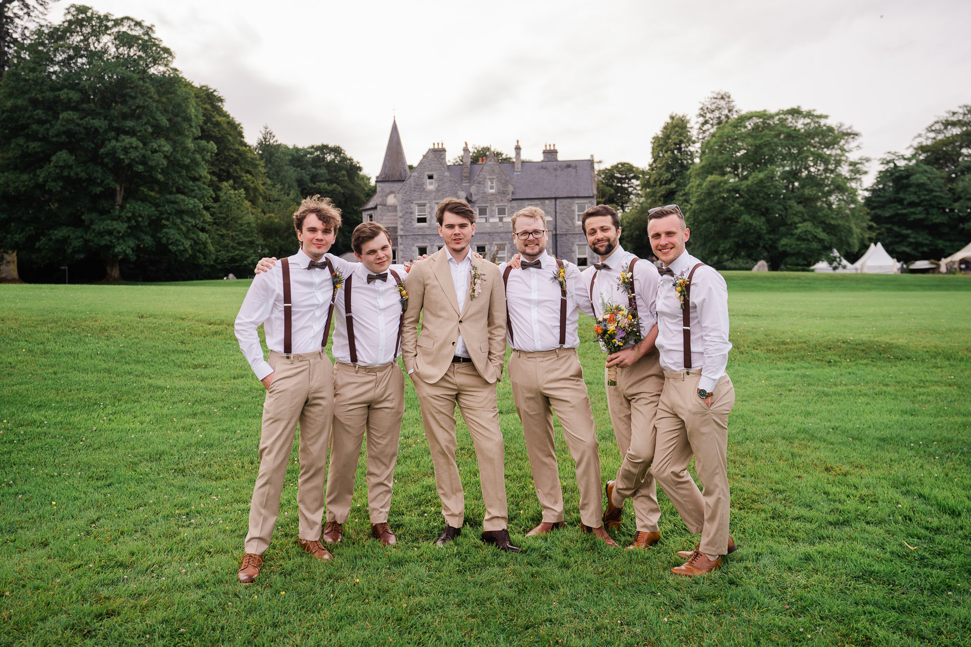 A group of men posing for a photo