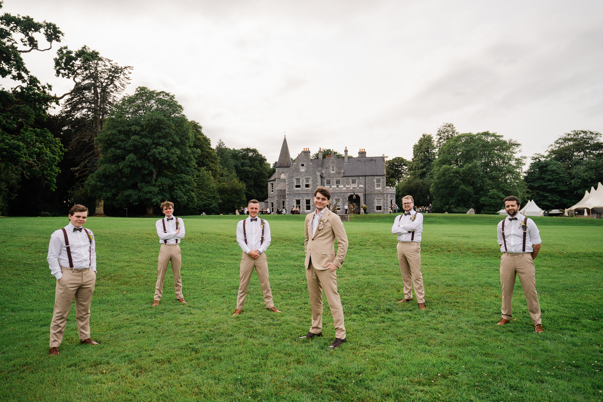 A group of men in uniform standing in a grassy field