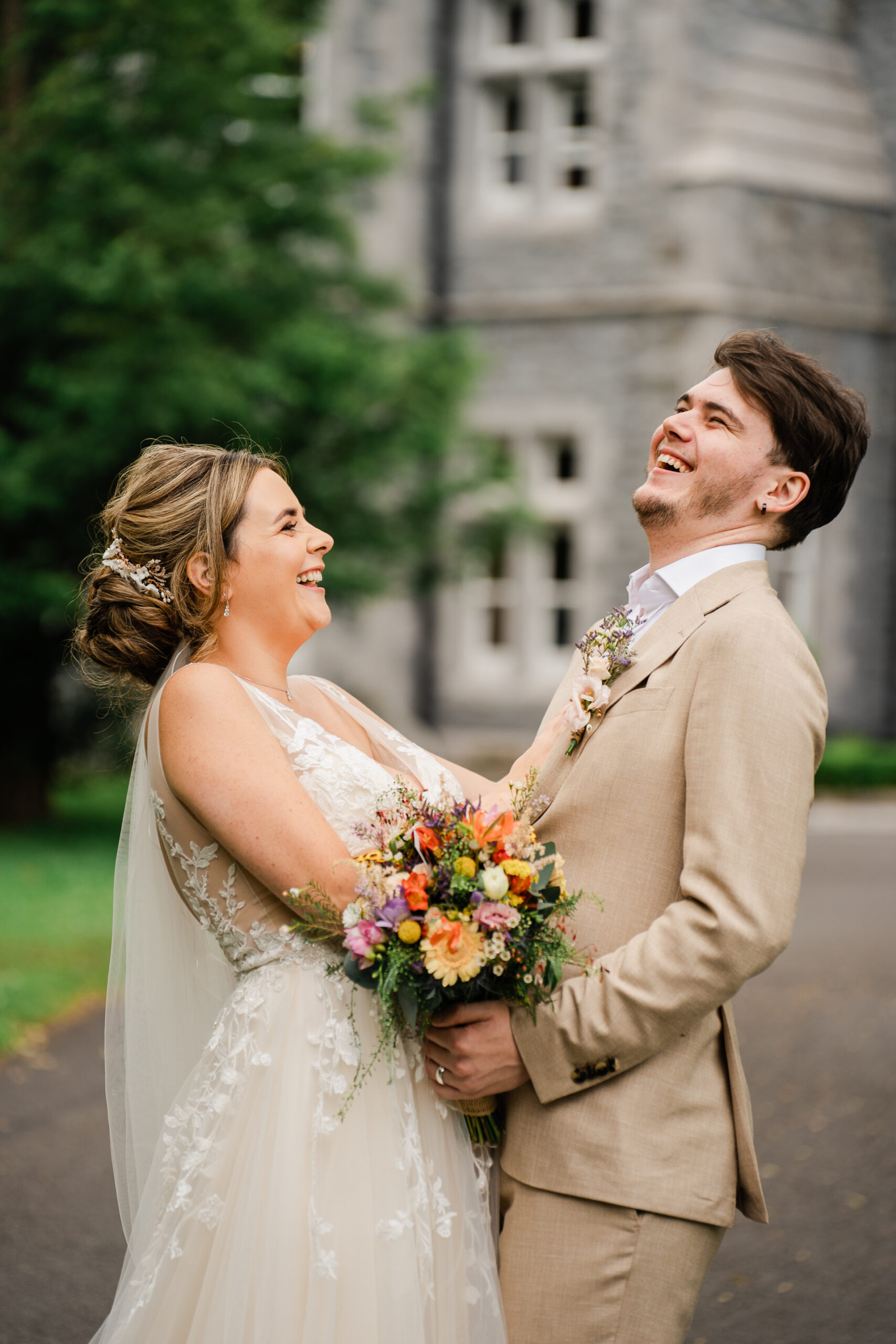 A man and woman holding flowers