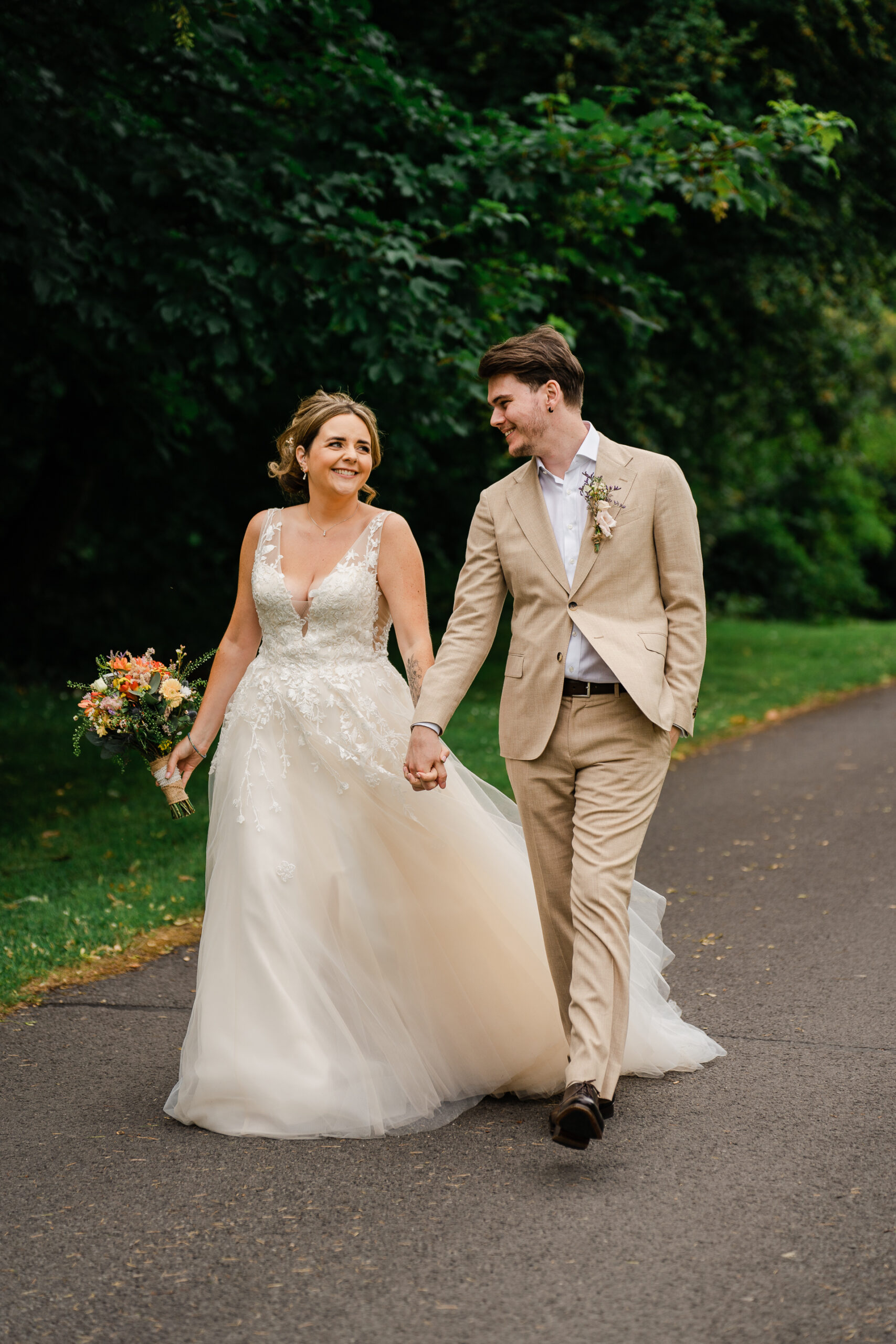 A man and woman walking down a road