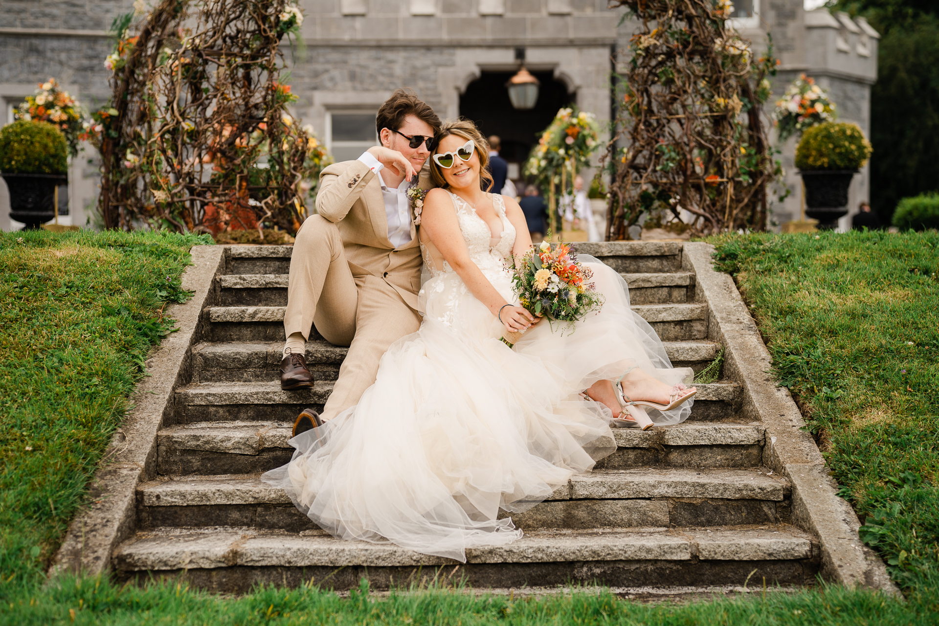 A man and woman posing for a picture on stairs