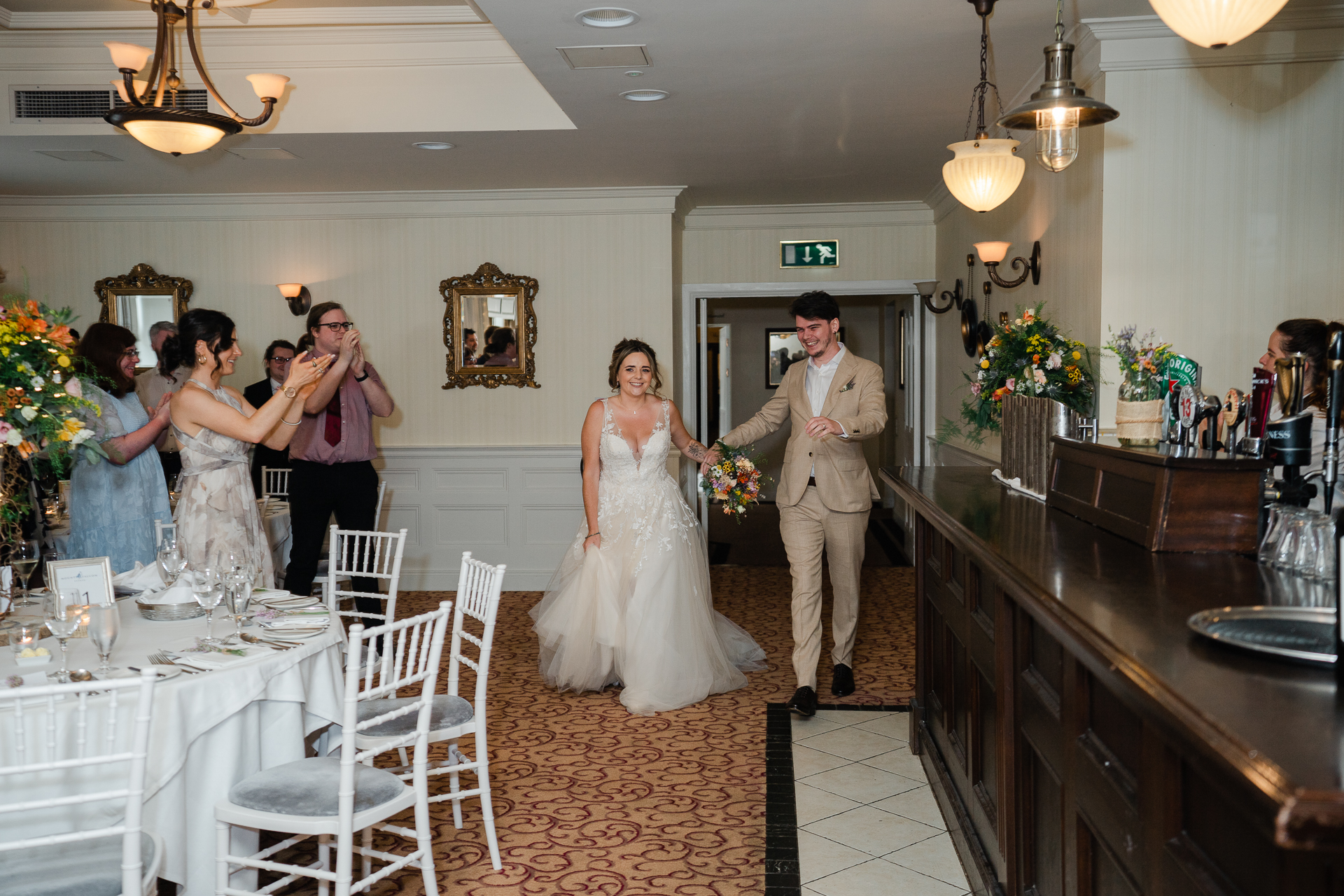 A bride and groom walking down the aisle