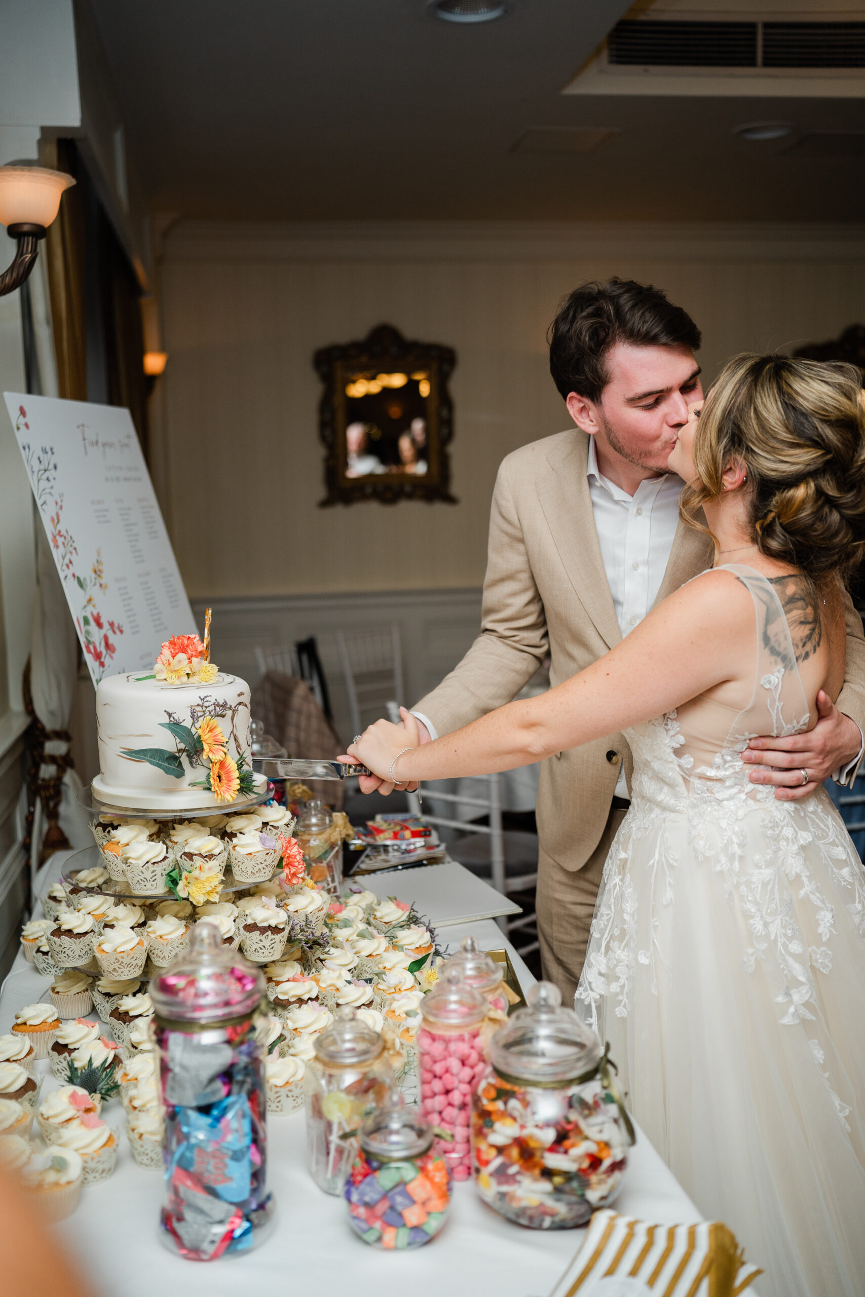 A bride and groom cutting a cake