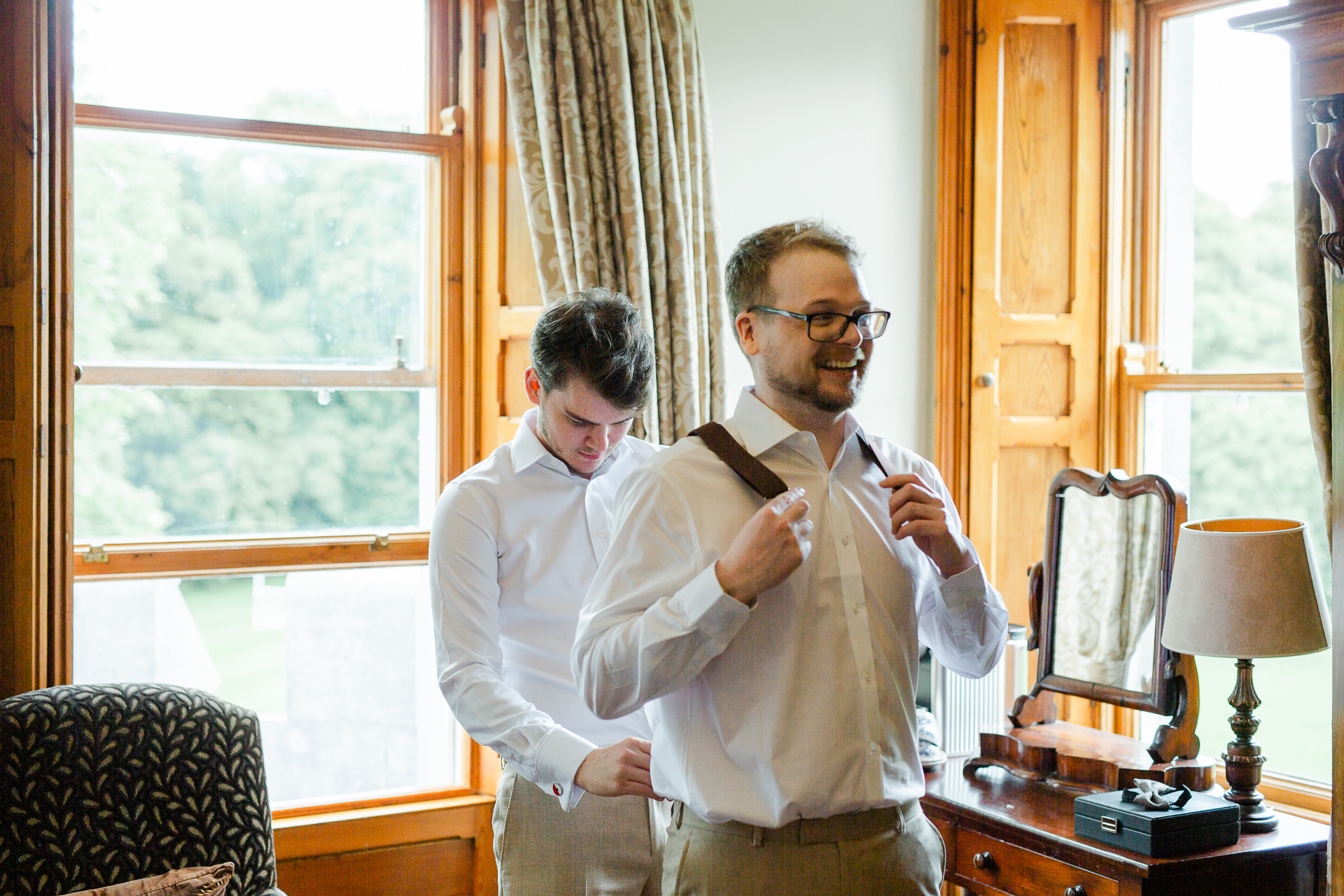 A person tying a tie