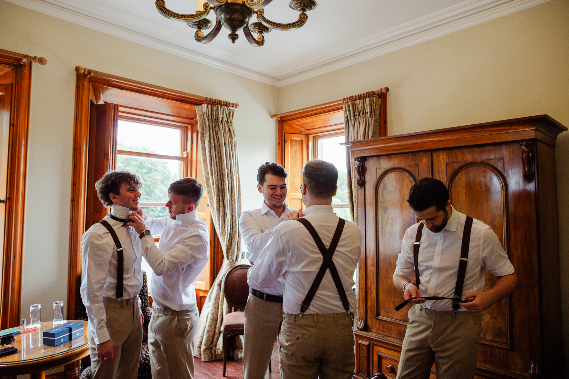 A group of men stand in a room