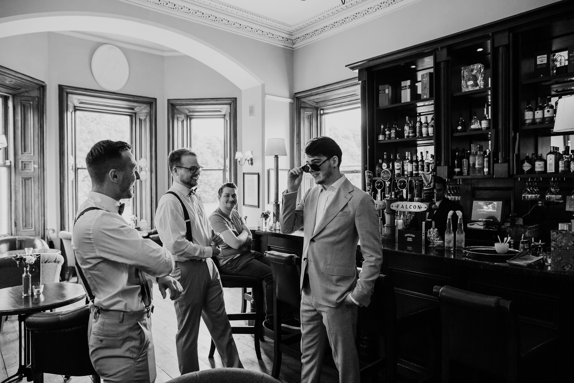 A group of men stand in a room