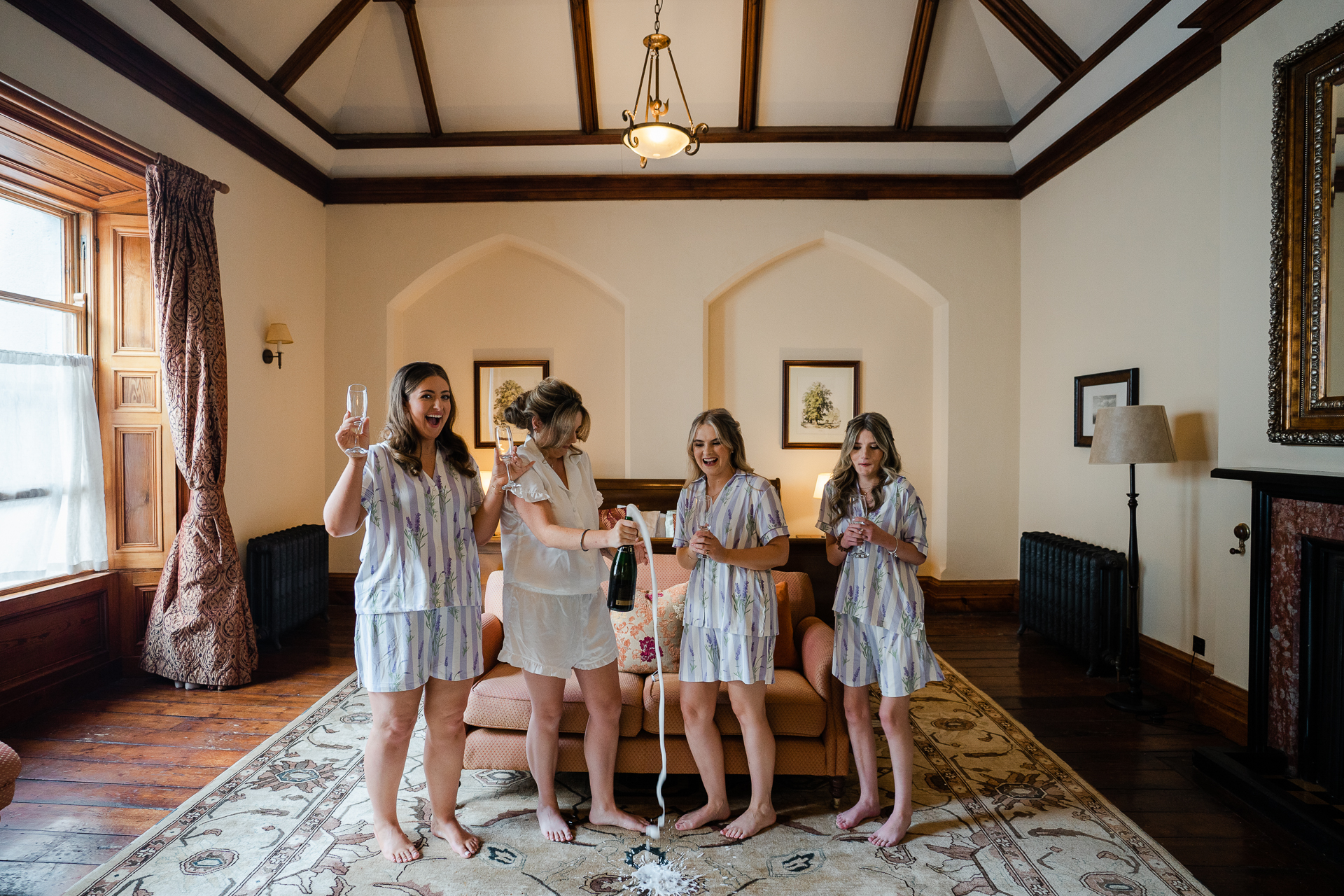 A group of women holding wine glasses