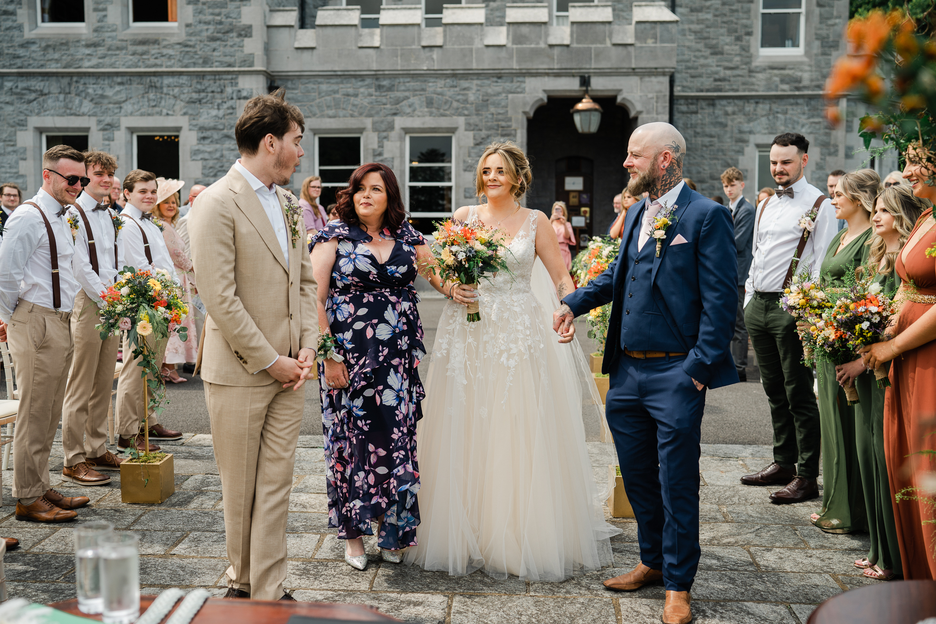 A bride and groom walking down the aisle