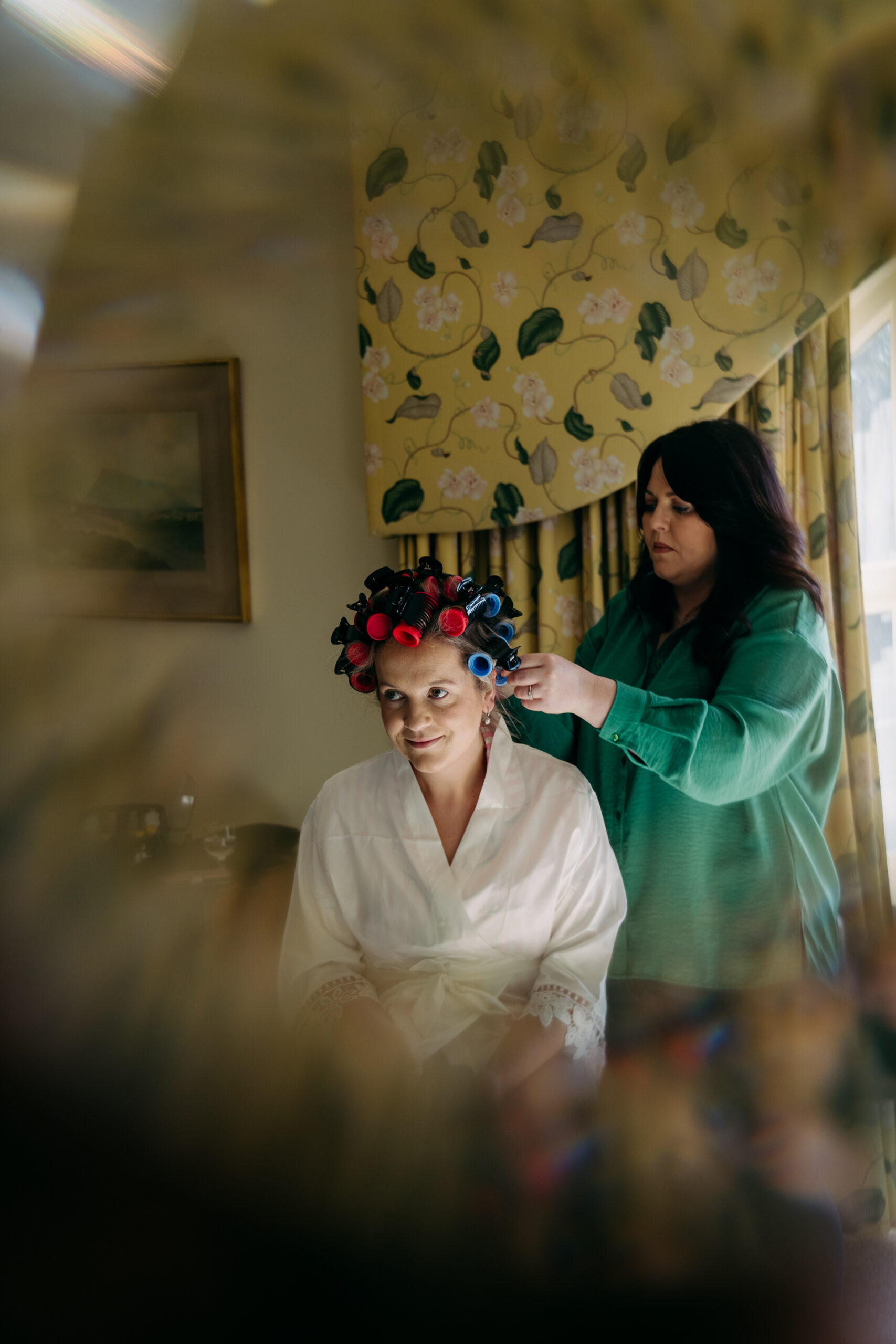 A person cutting another woman's hair