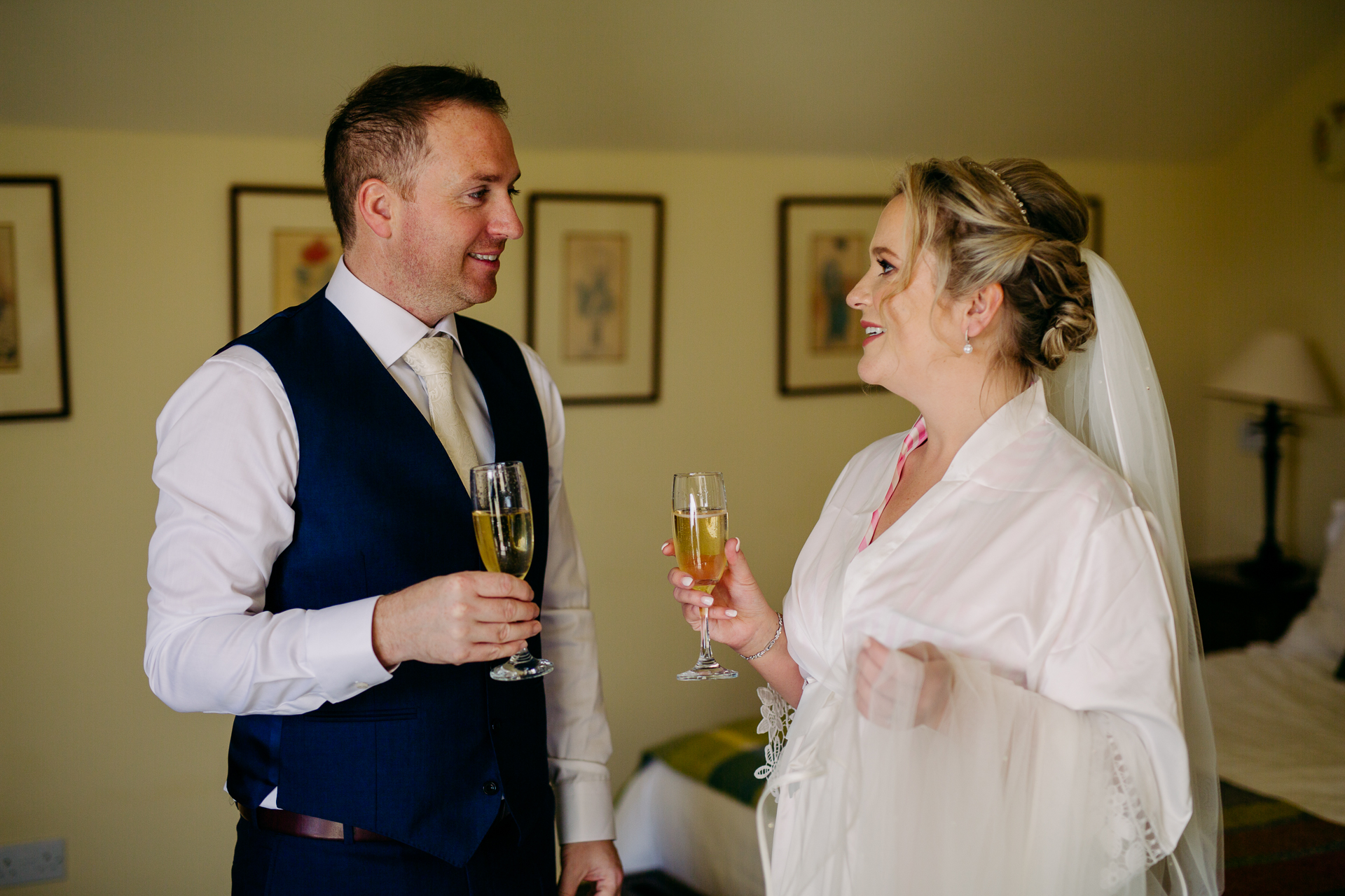 A man and a woman holding wine glasses