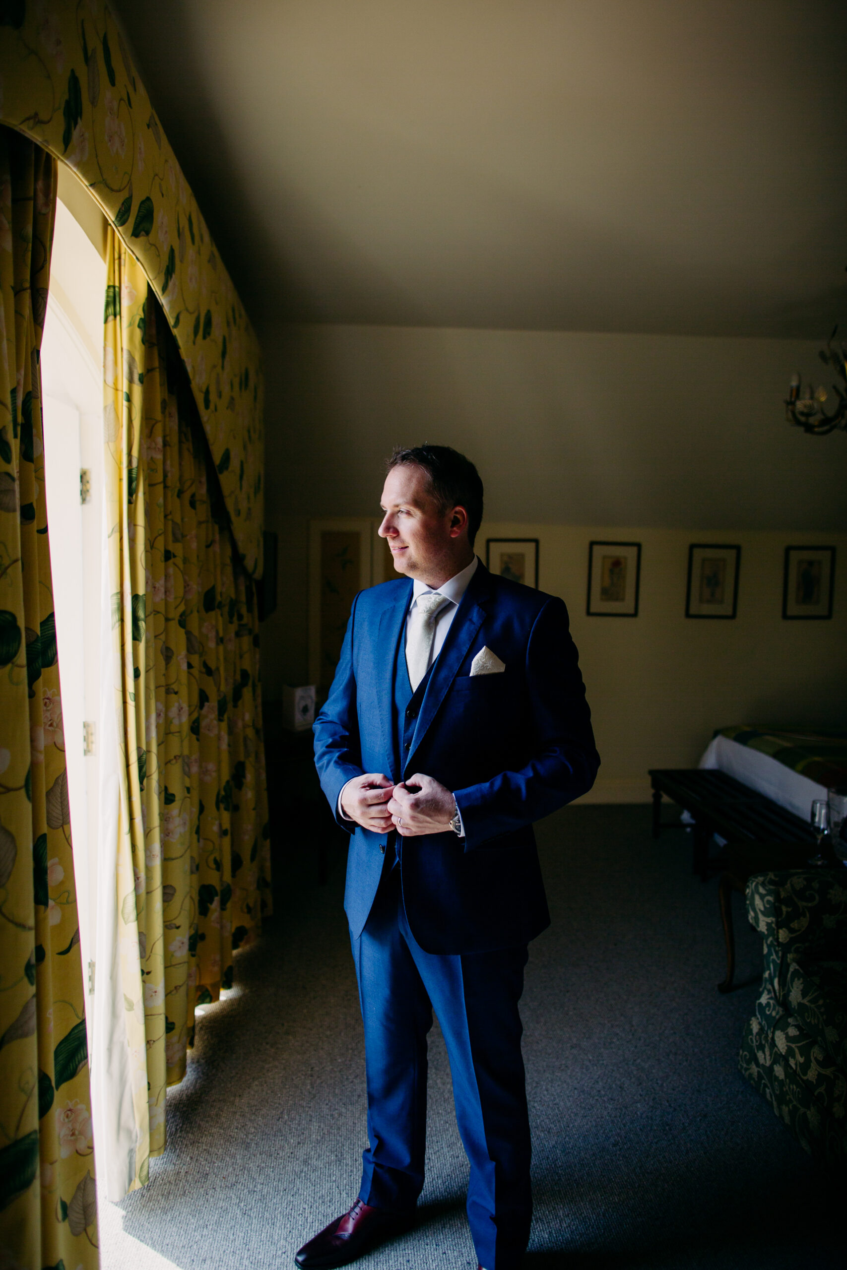 A man in a suit standing in a room