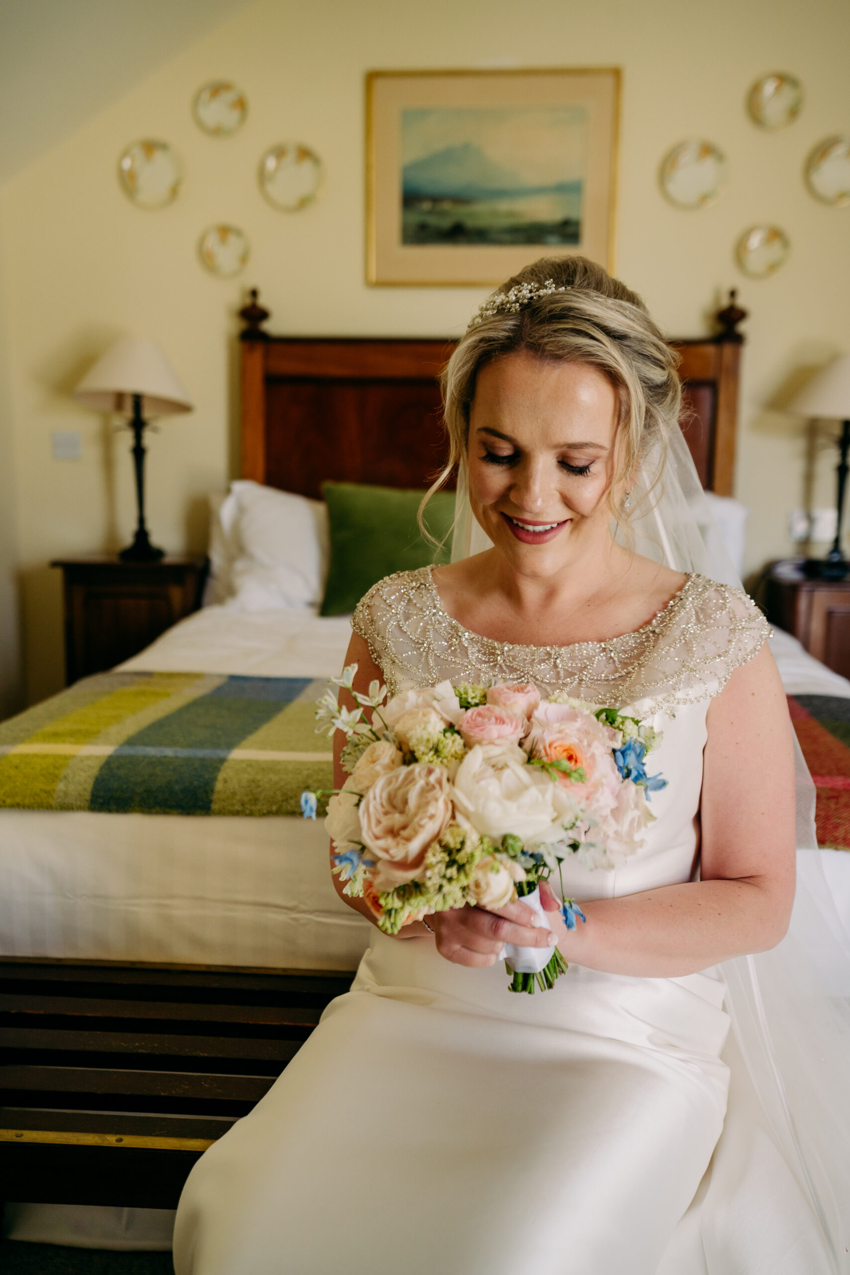 A person in a white dress holding a bouquet of flowers