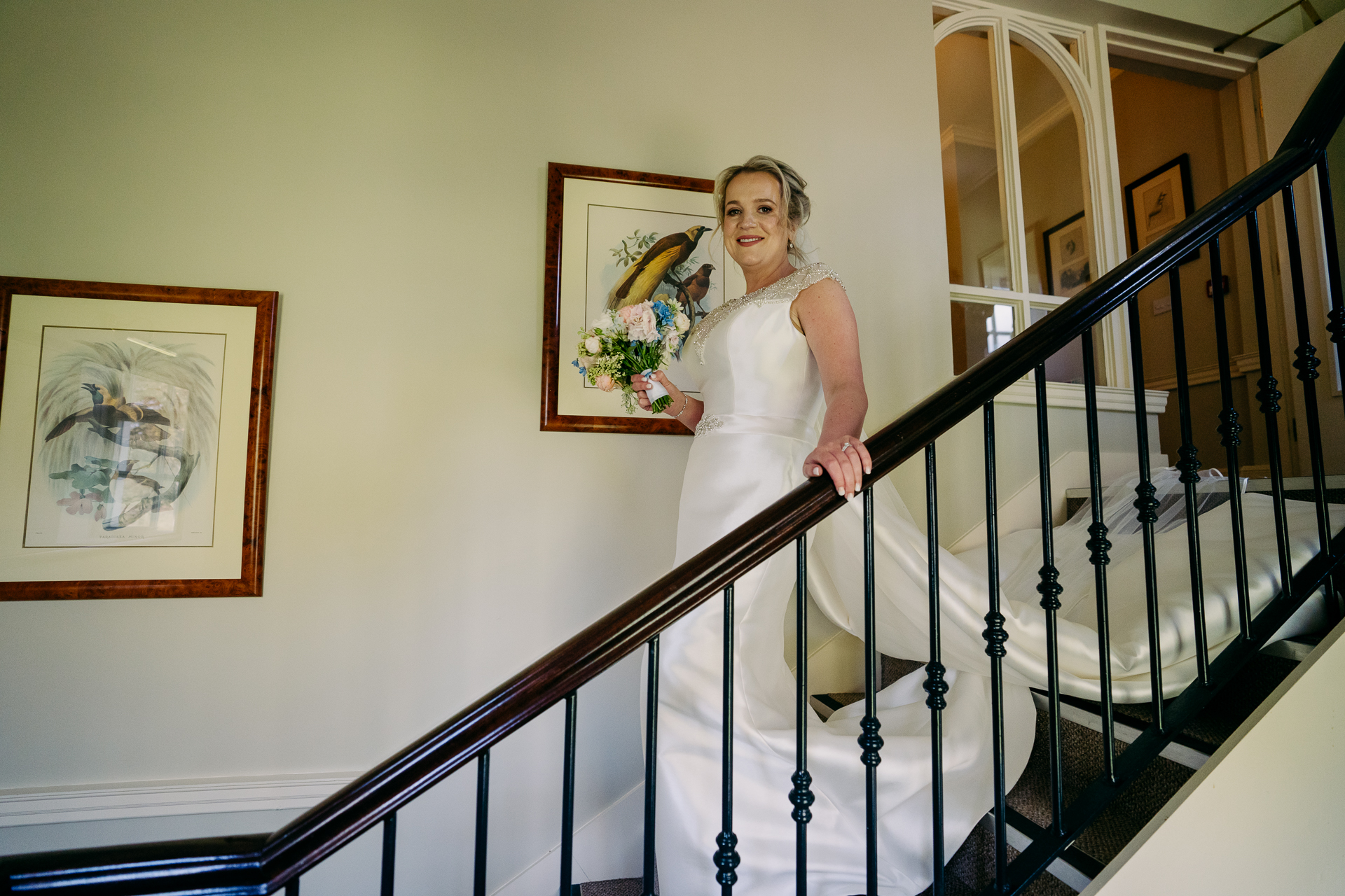 A person in a wedding dress on a staircase