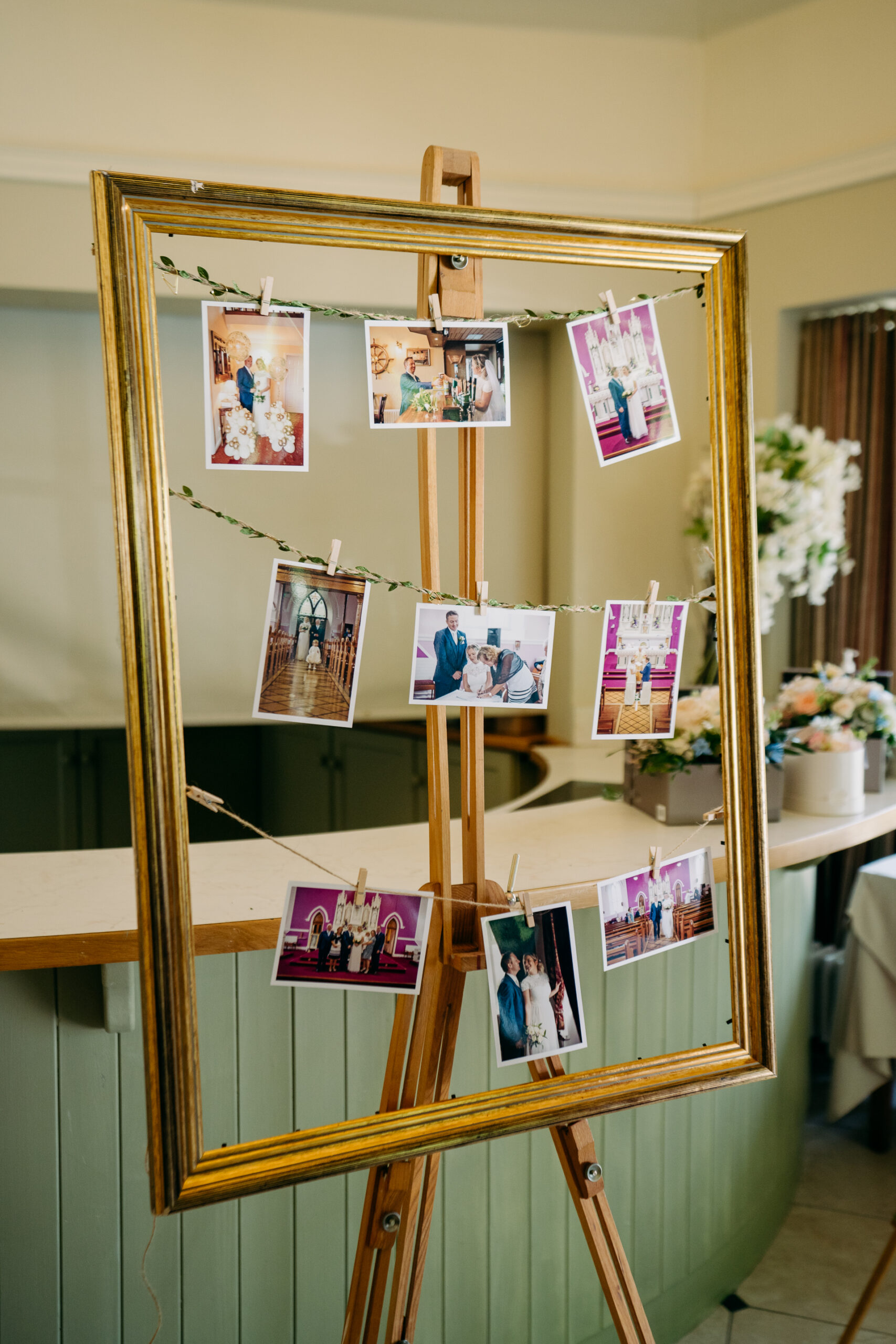 A wooden shelf with pictures on it