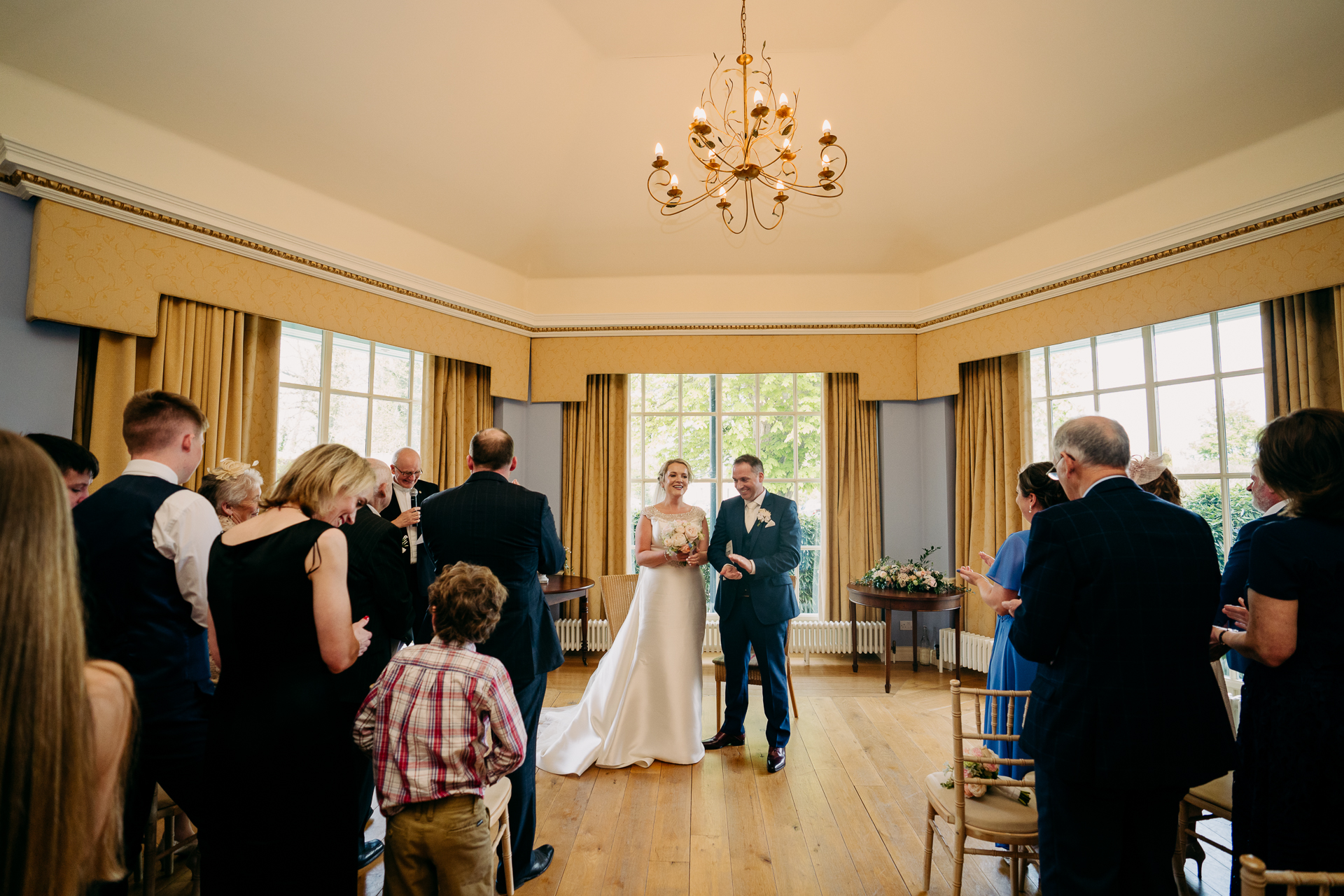 A bride and groom walking down the aisle