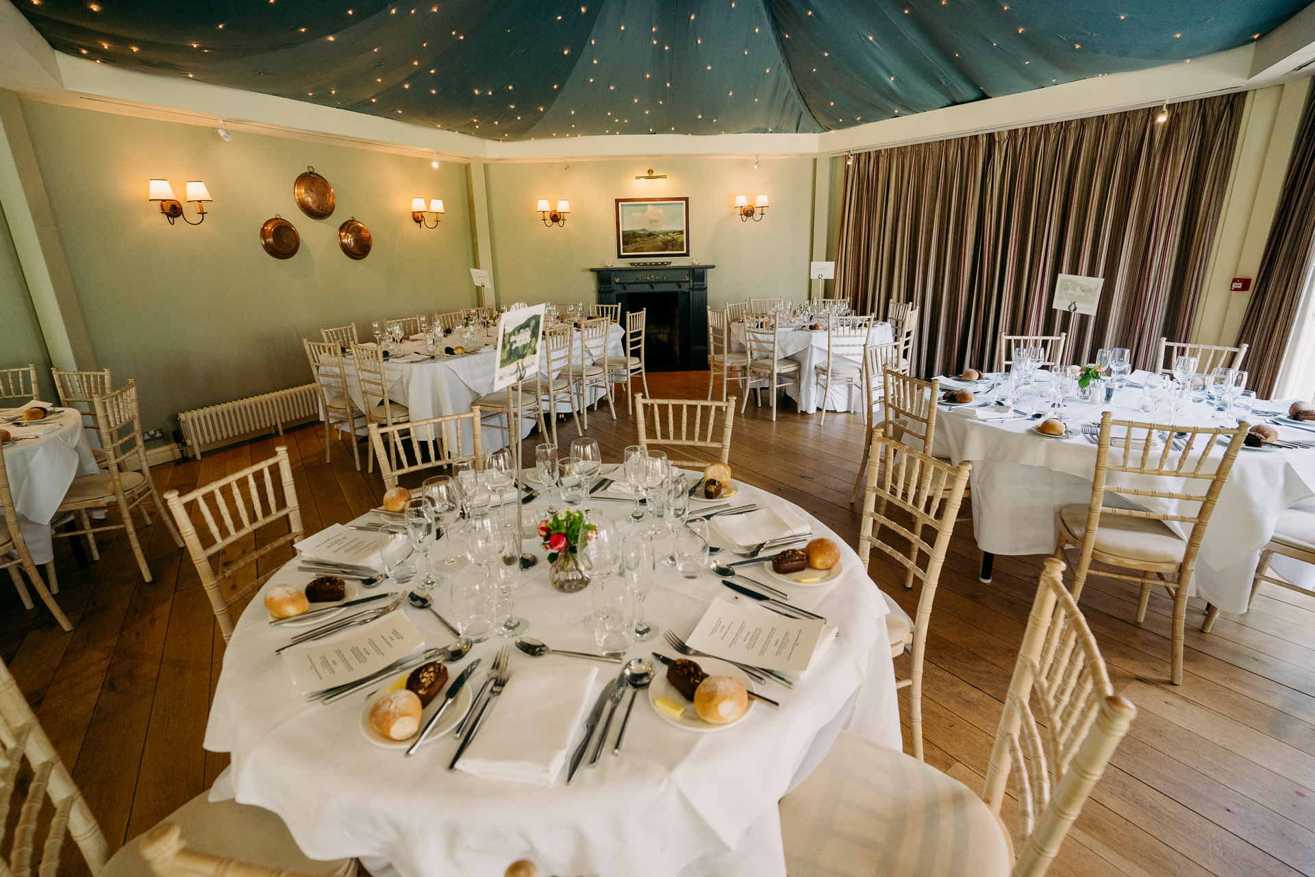 A large room with tables set for a meal