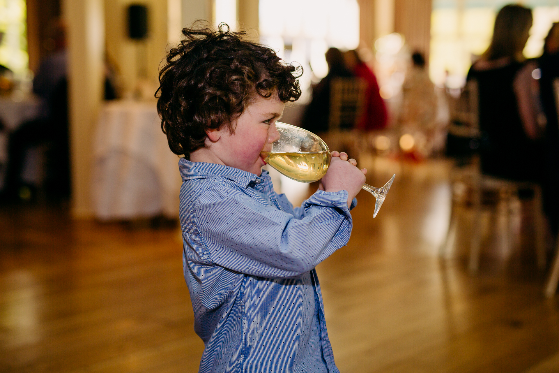 A child drinking from a glass