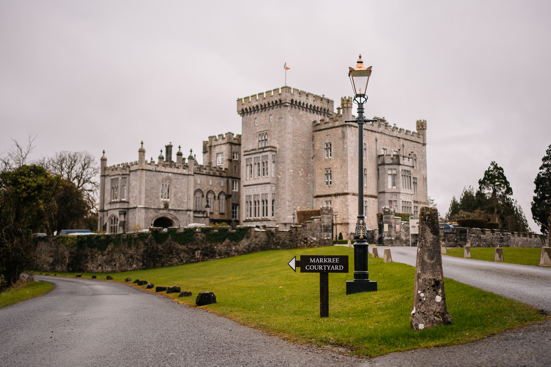 A large castle with a sign in front of it