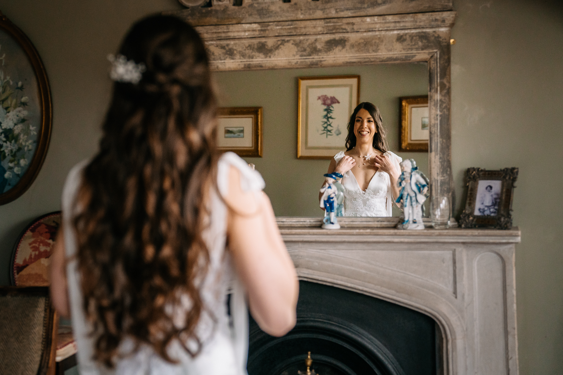 A person taking a picture of a person in a dress