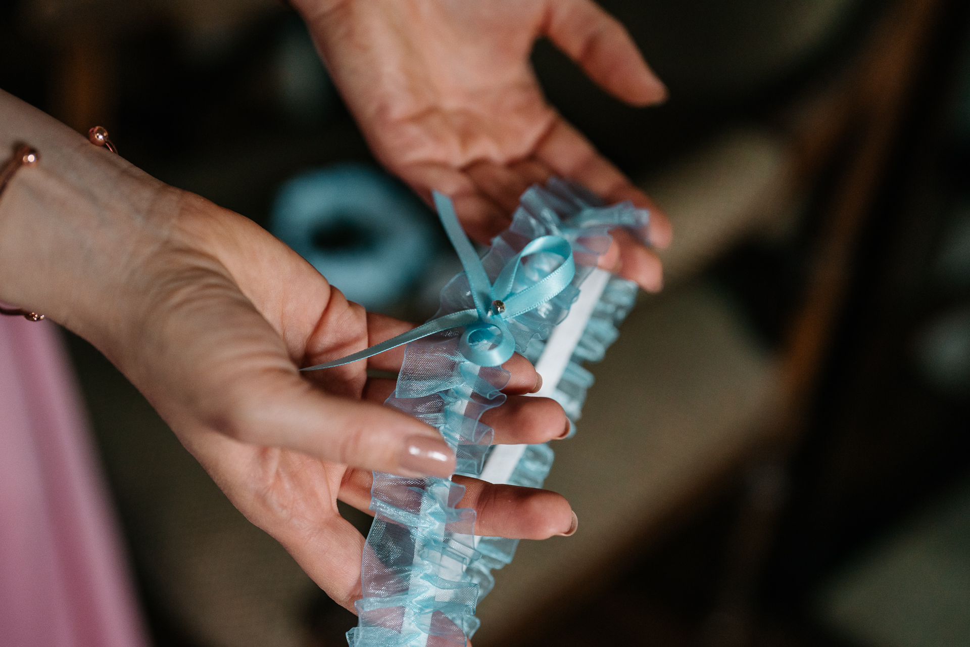 A person holding a small blue object