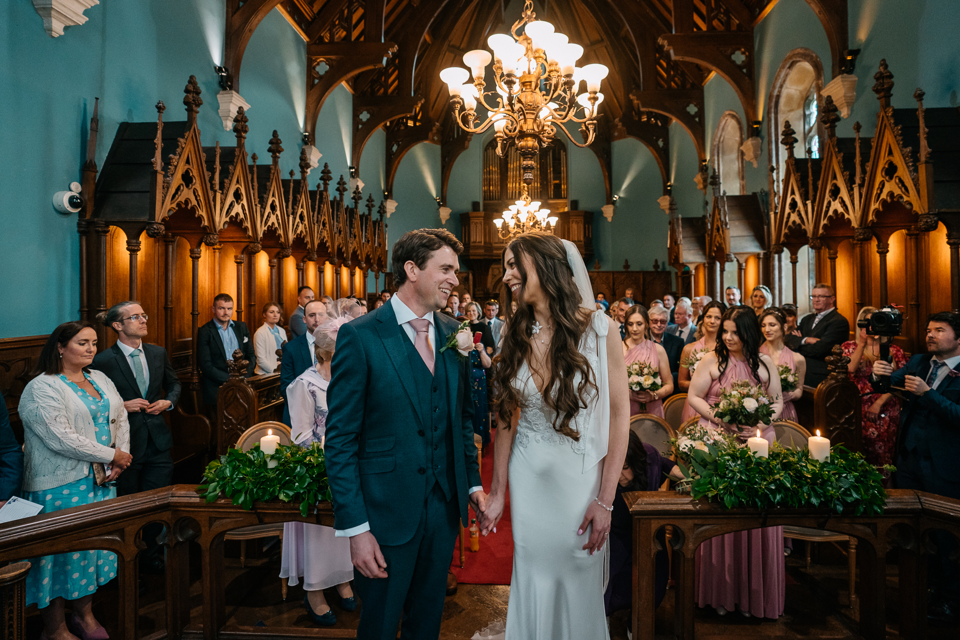 A man and woman walking down a hall way