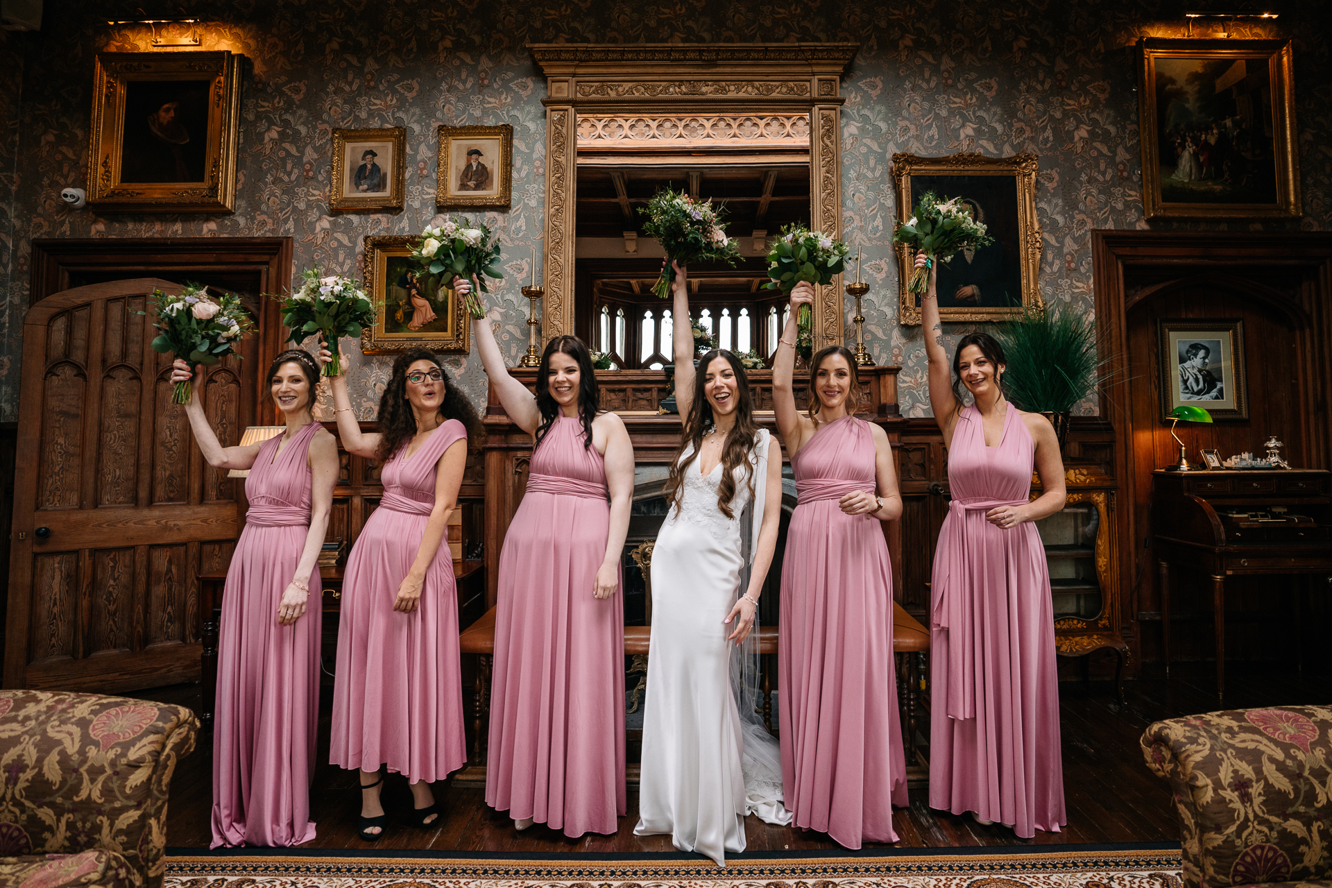 A group of women in dresses posing for a photo