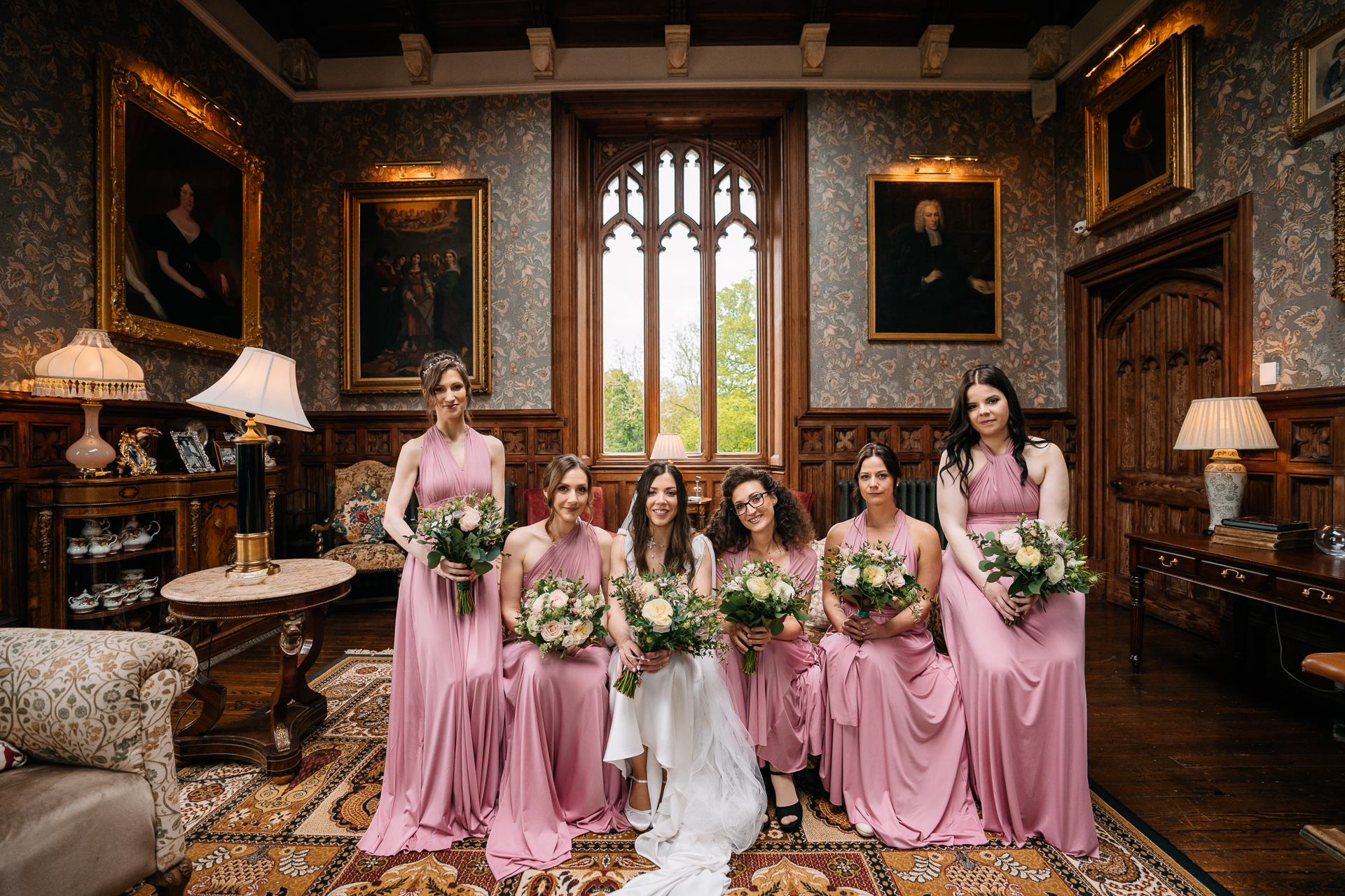 A group of women in dresses posing for a photo