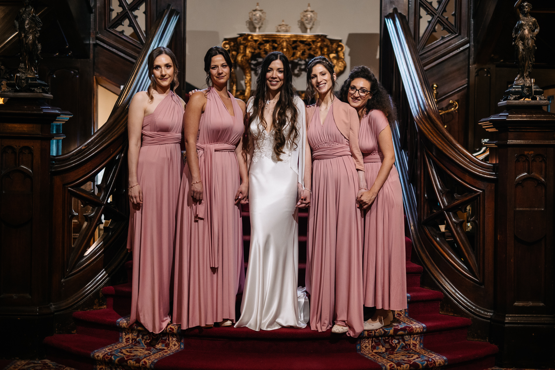 A group of women in dresses posing for a photo