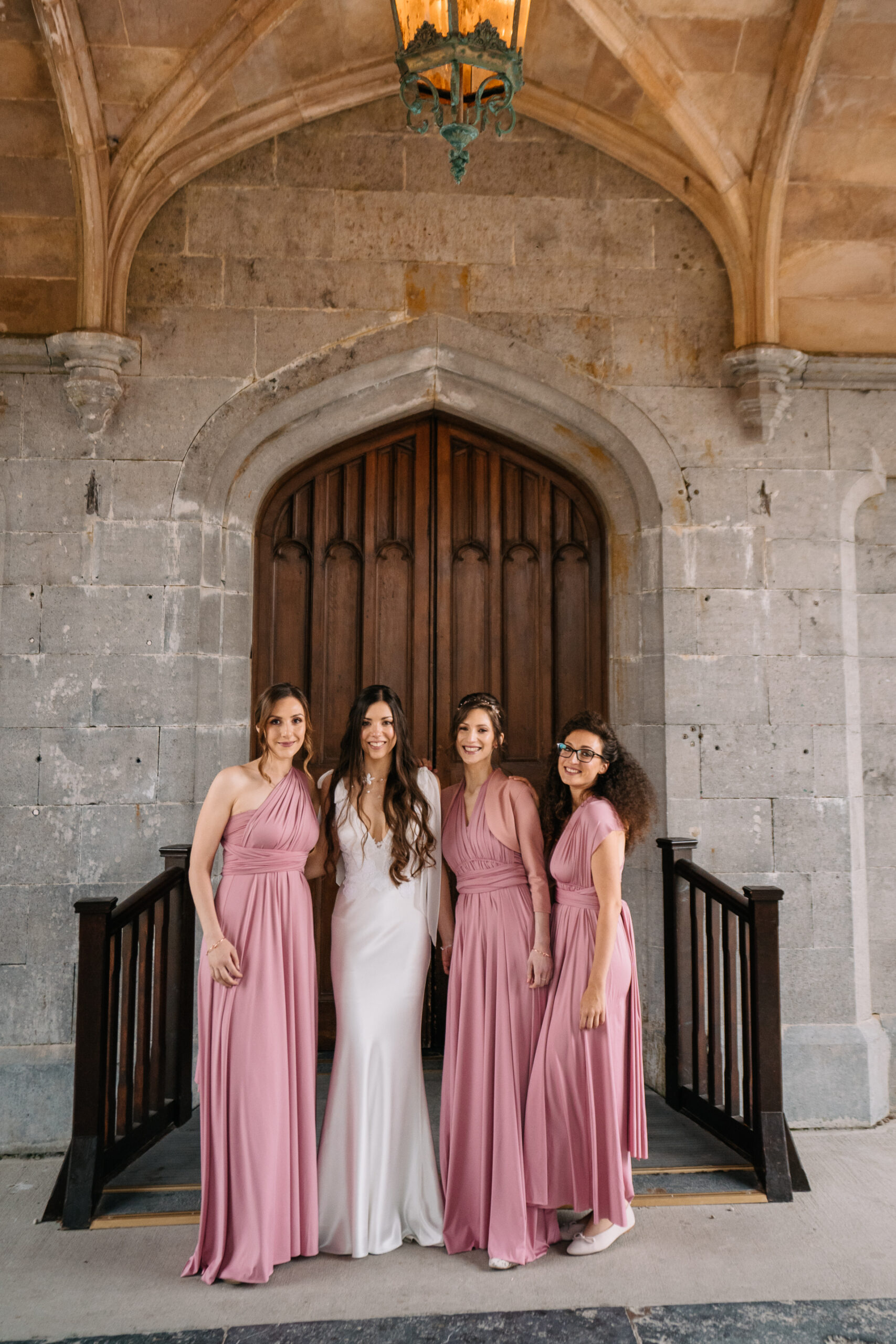 A group of women in dresses posing for a photo