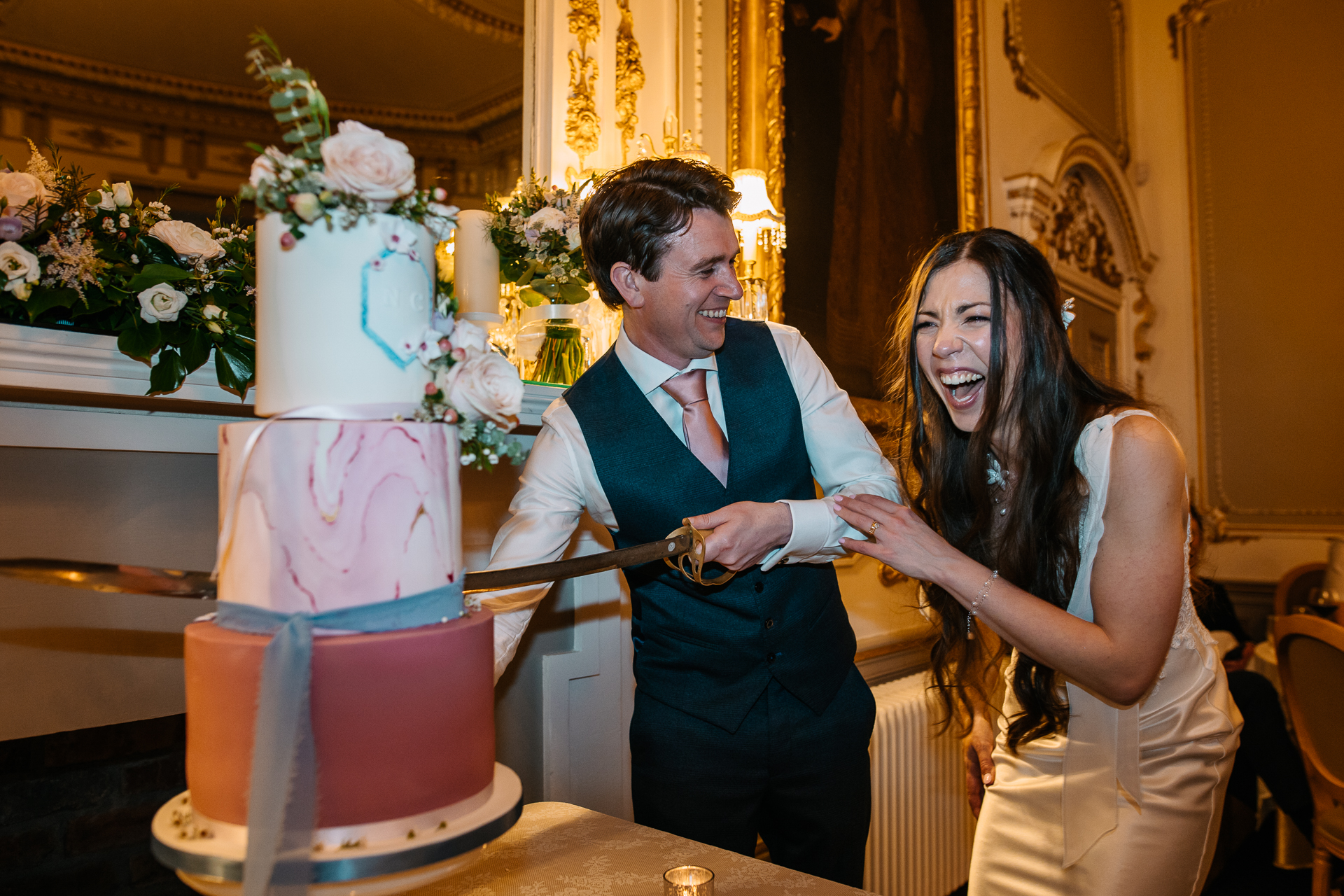 A couple cutting a cake