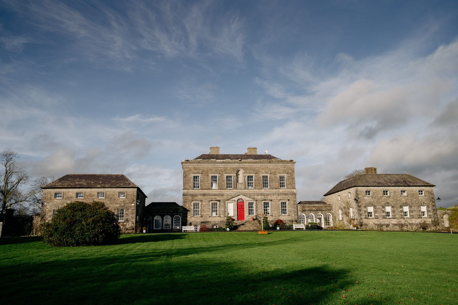 A large building with a lawn in front of it