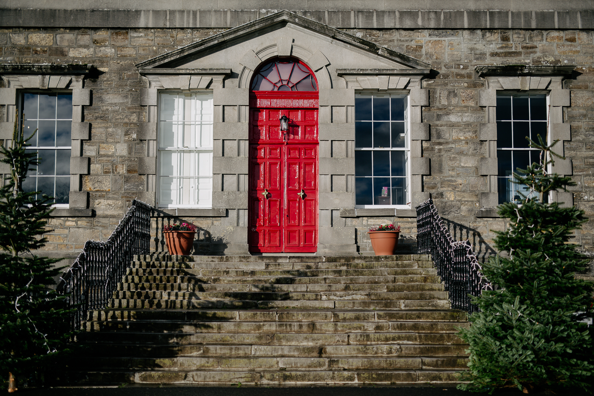 A red door on a stone building