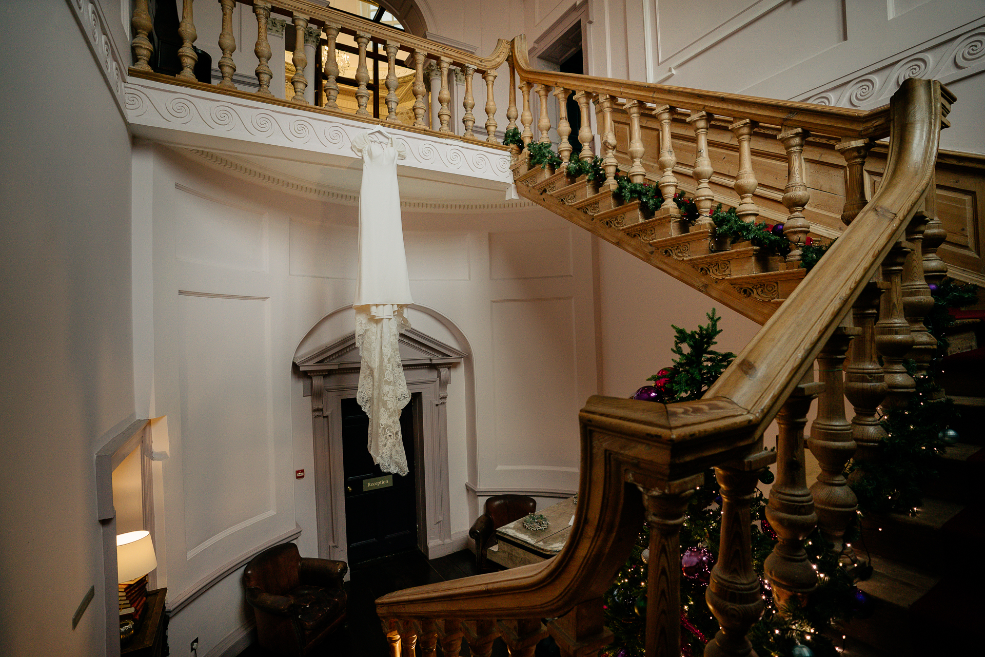 A staircase with a white pillar