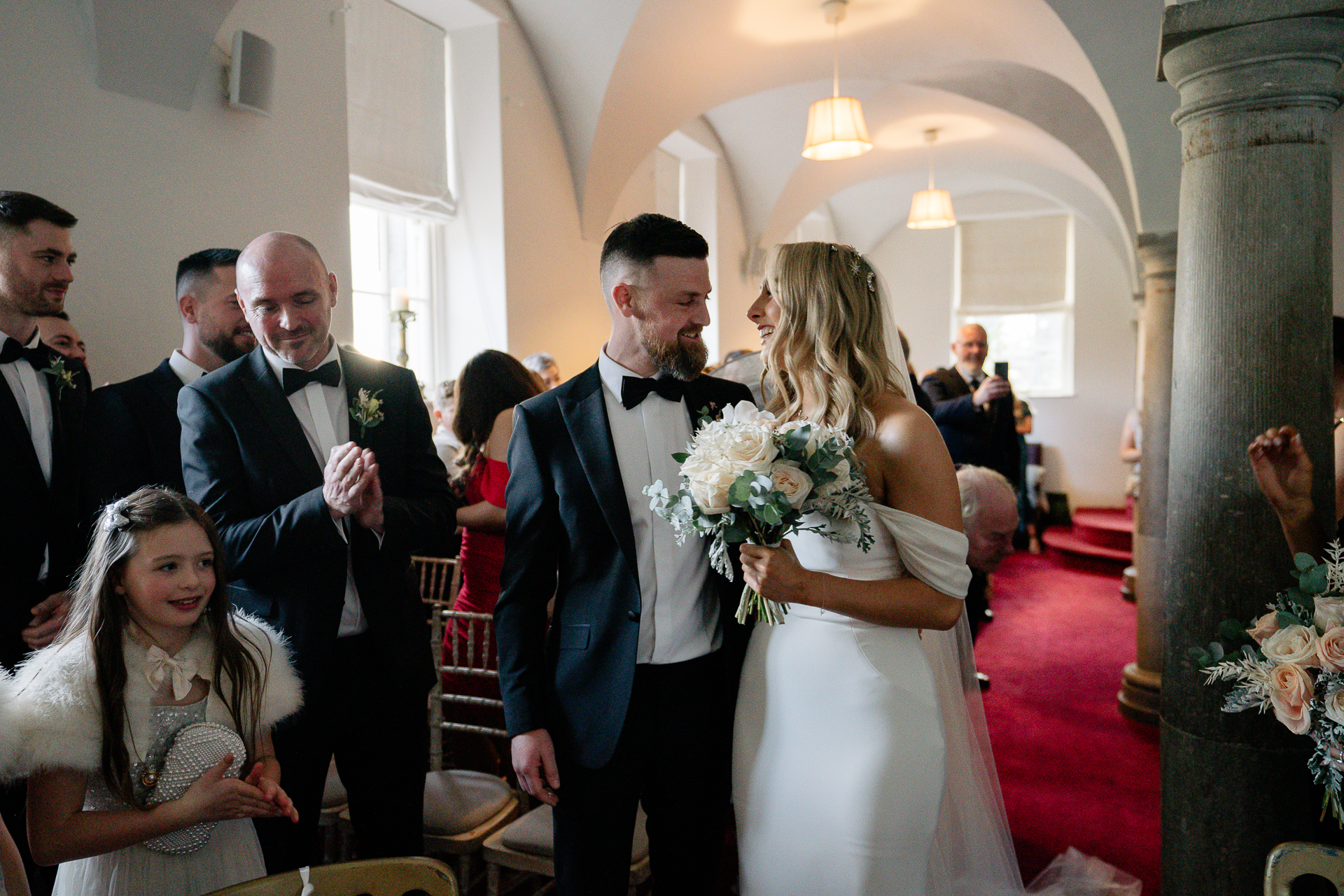 A man and woman walking down a aisle