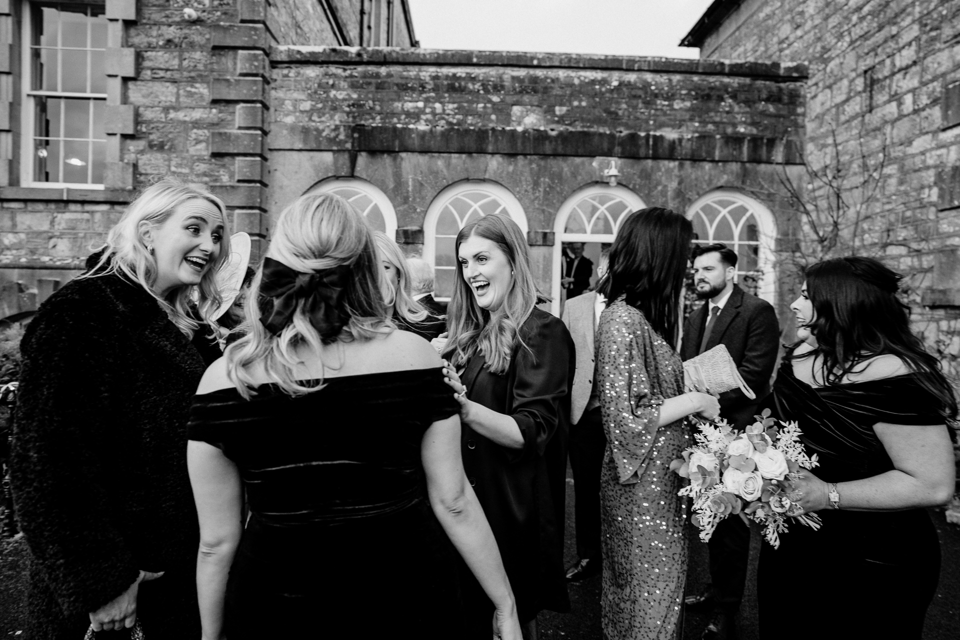 A group of women in black dresses