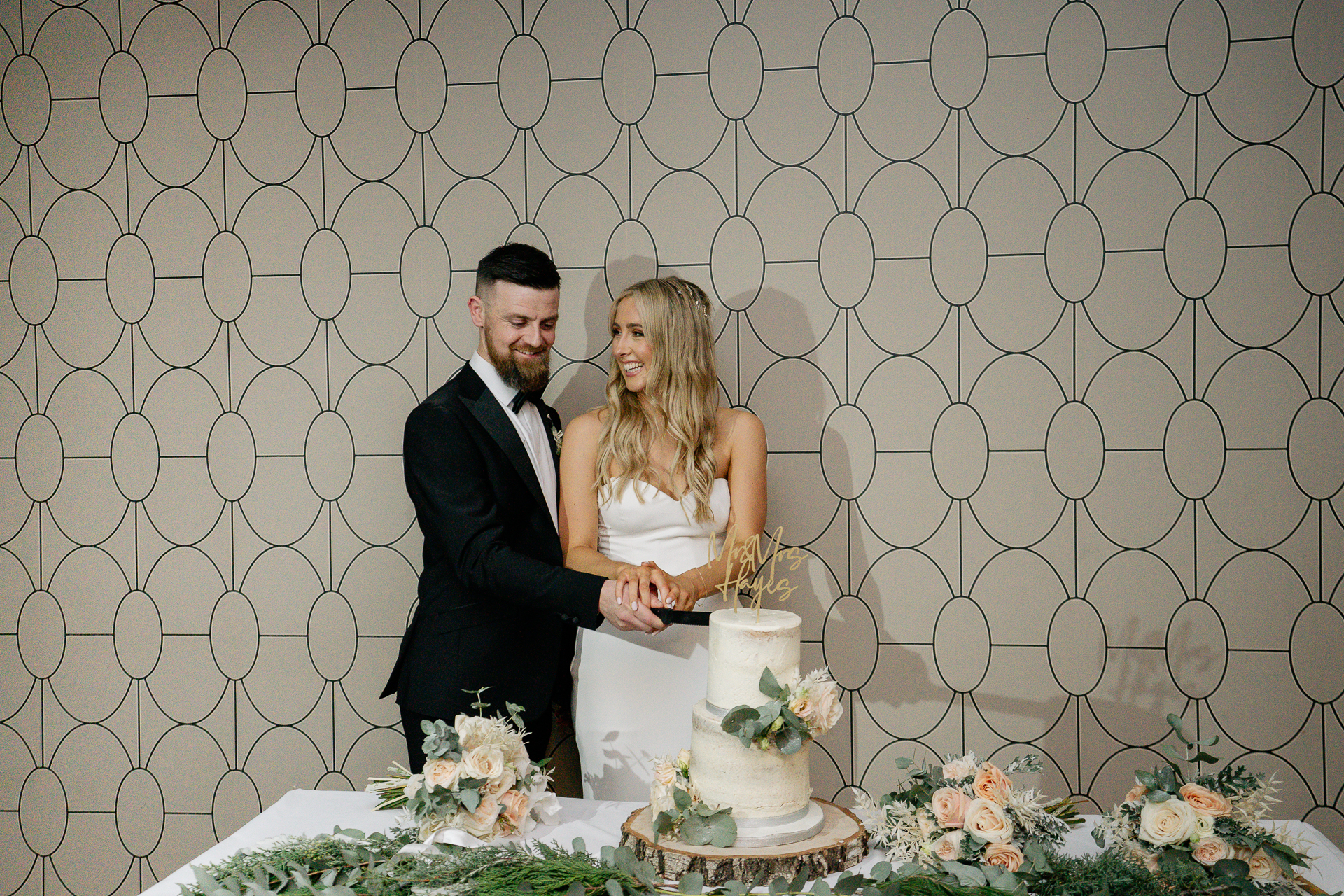 A bride and groom cutting a wedding cake