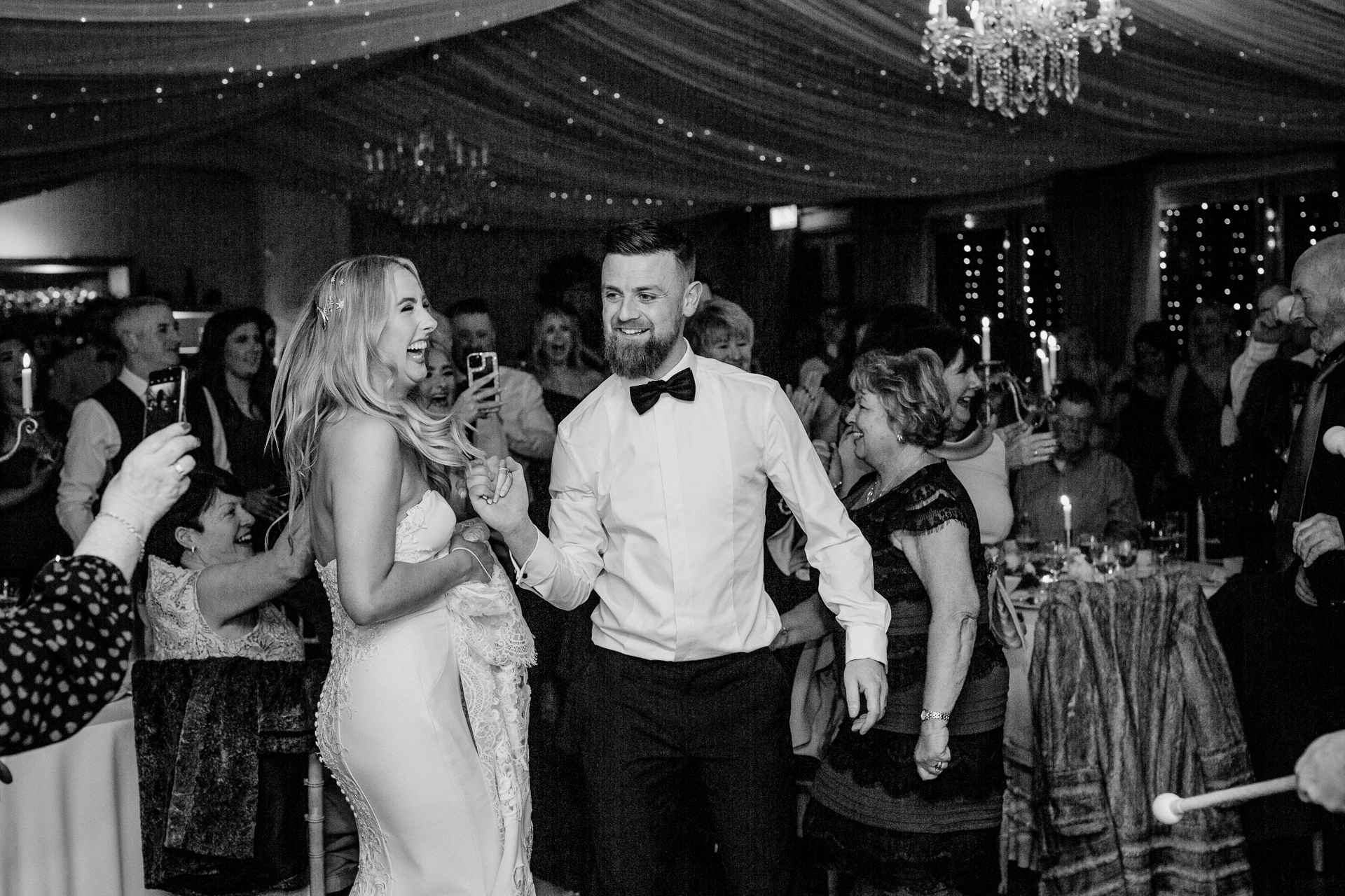 A man and woman dancing at a wedding reception