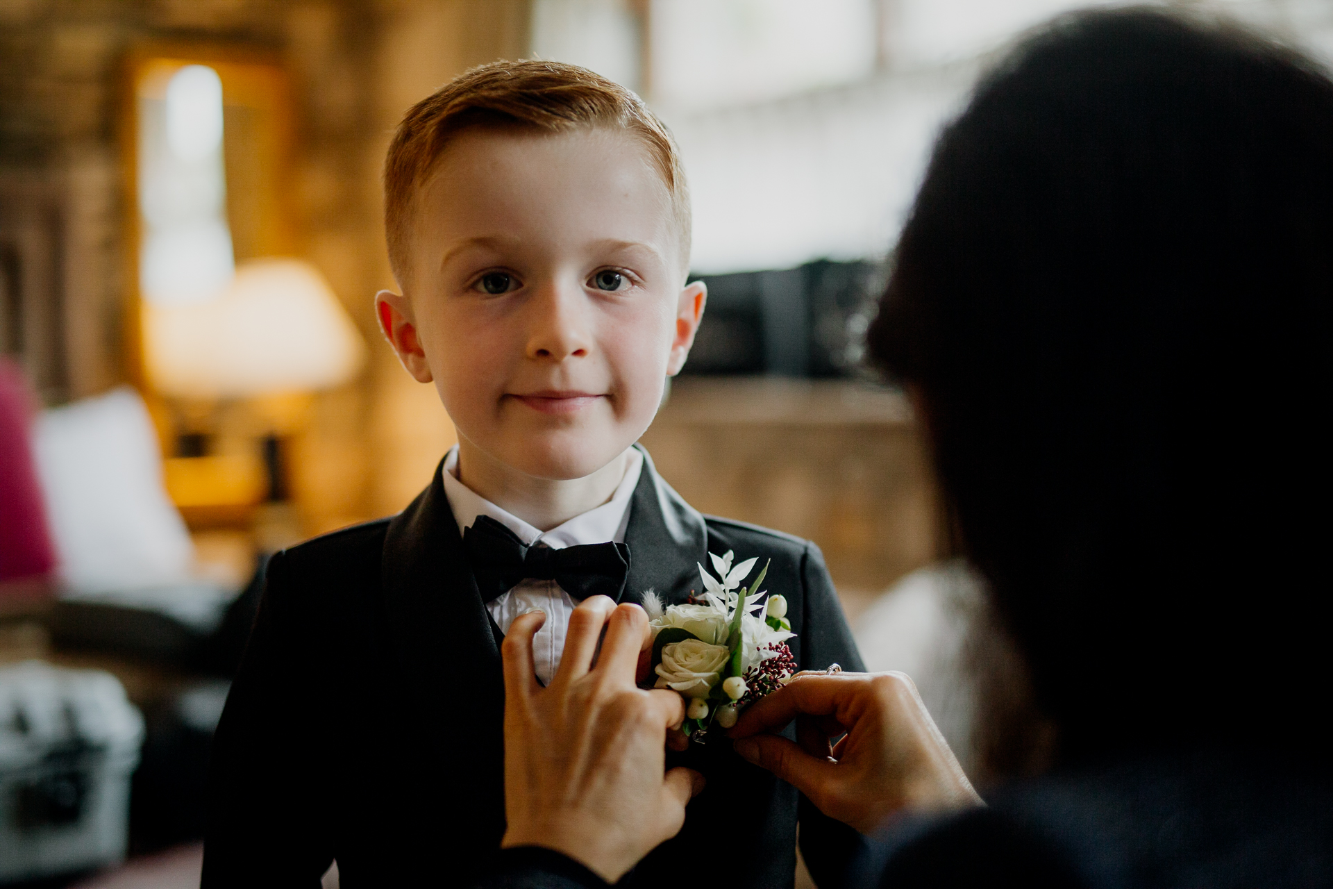 A boy holding a bouquet of flowers