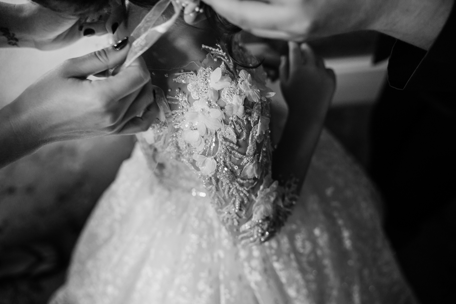 A person getting the wedding dress done