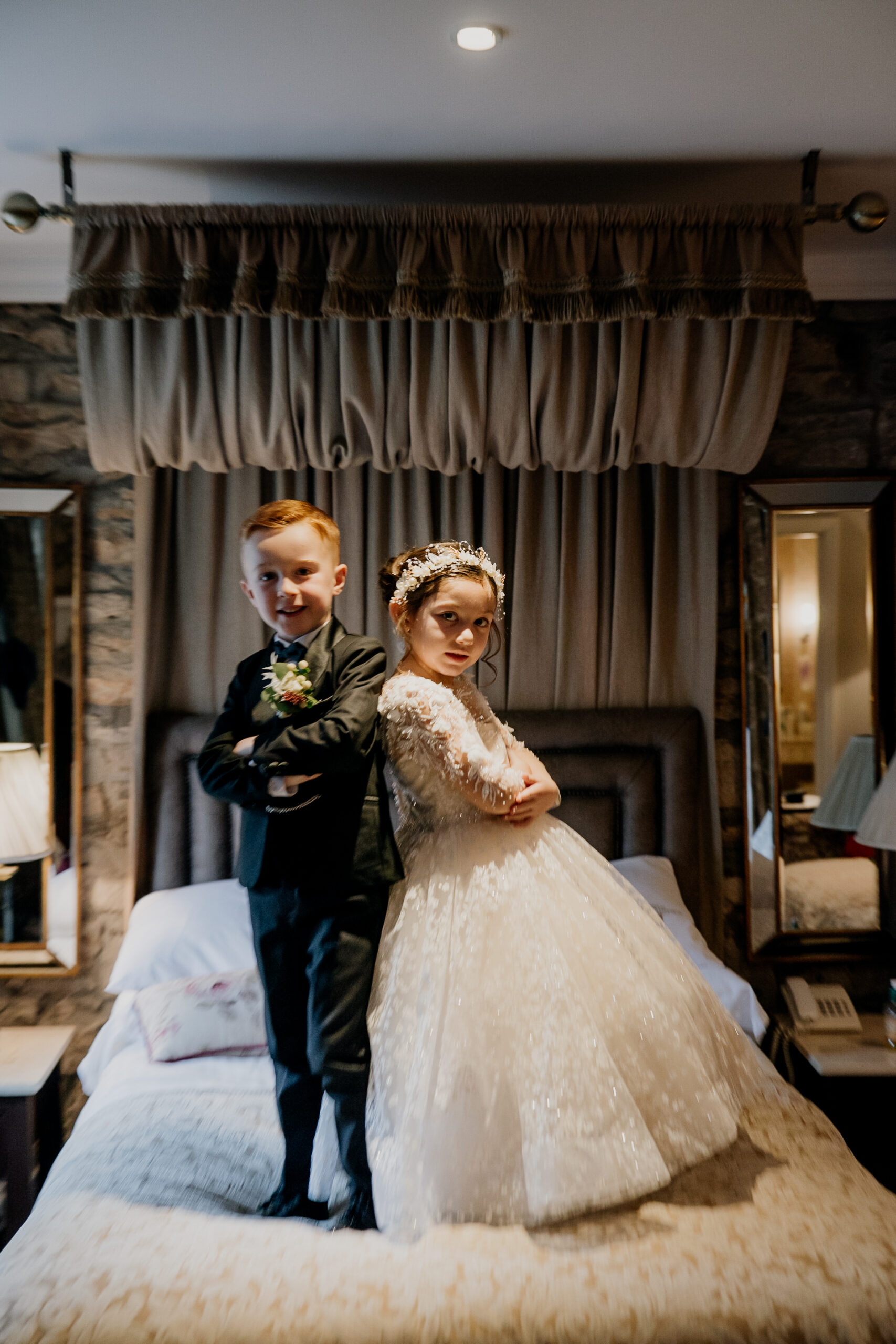 A boy and girl posing for a picture