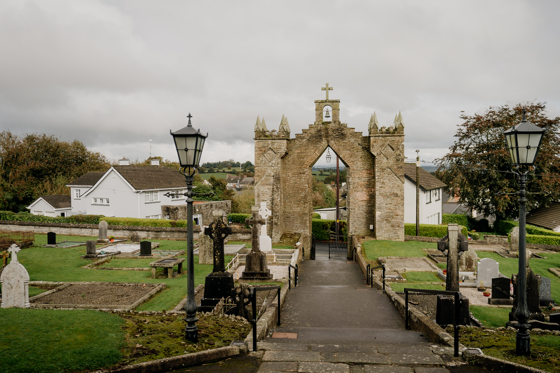 A stone building with a cross on top