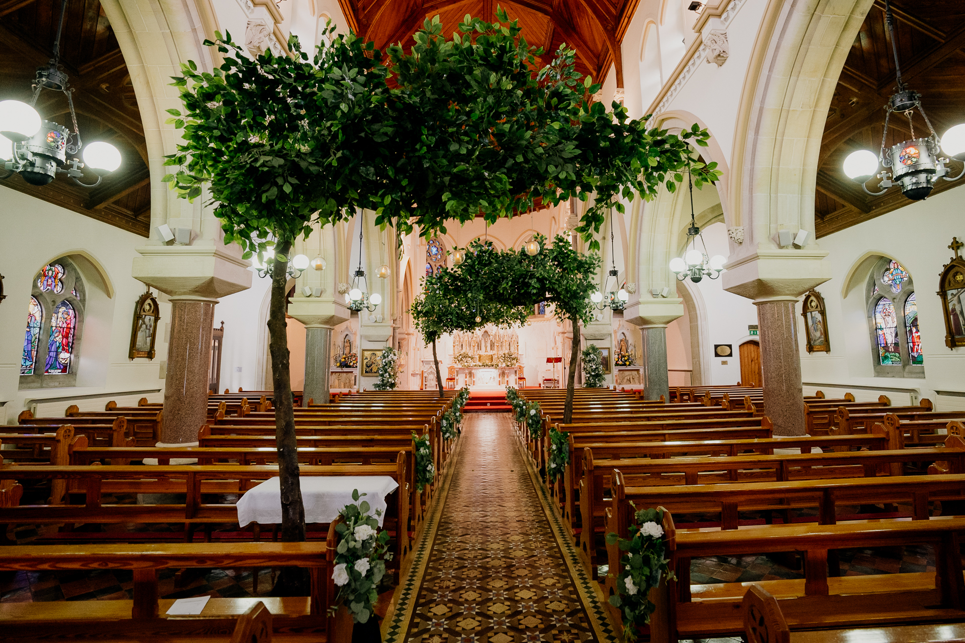 A large church with a large tree