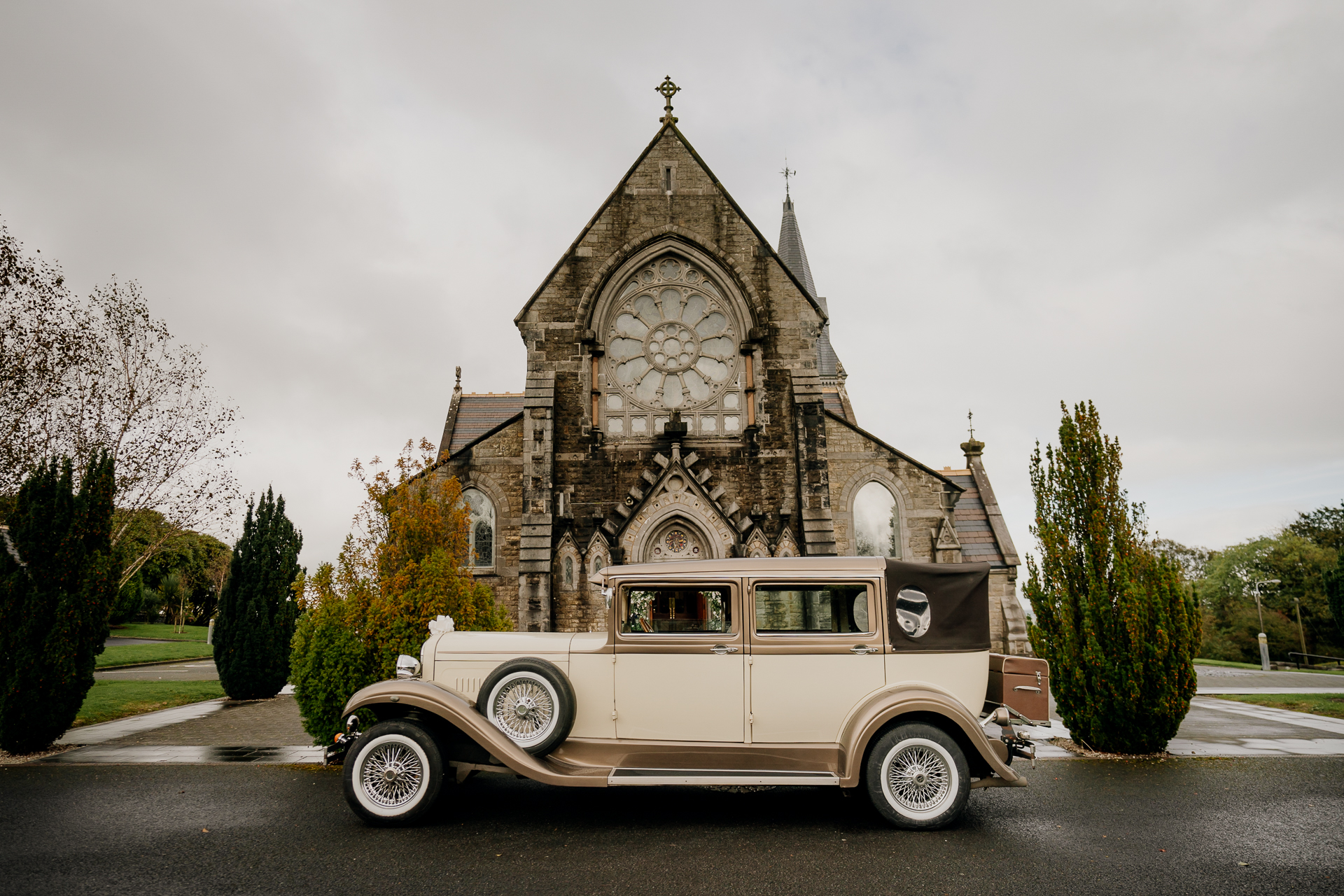 A car parked in front of a church