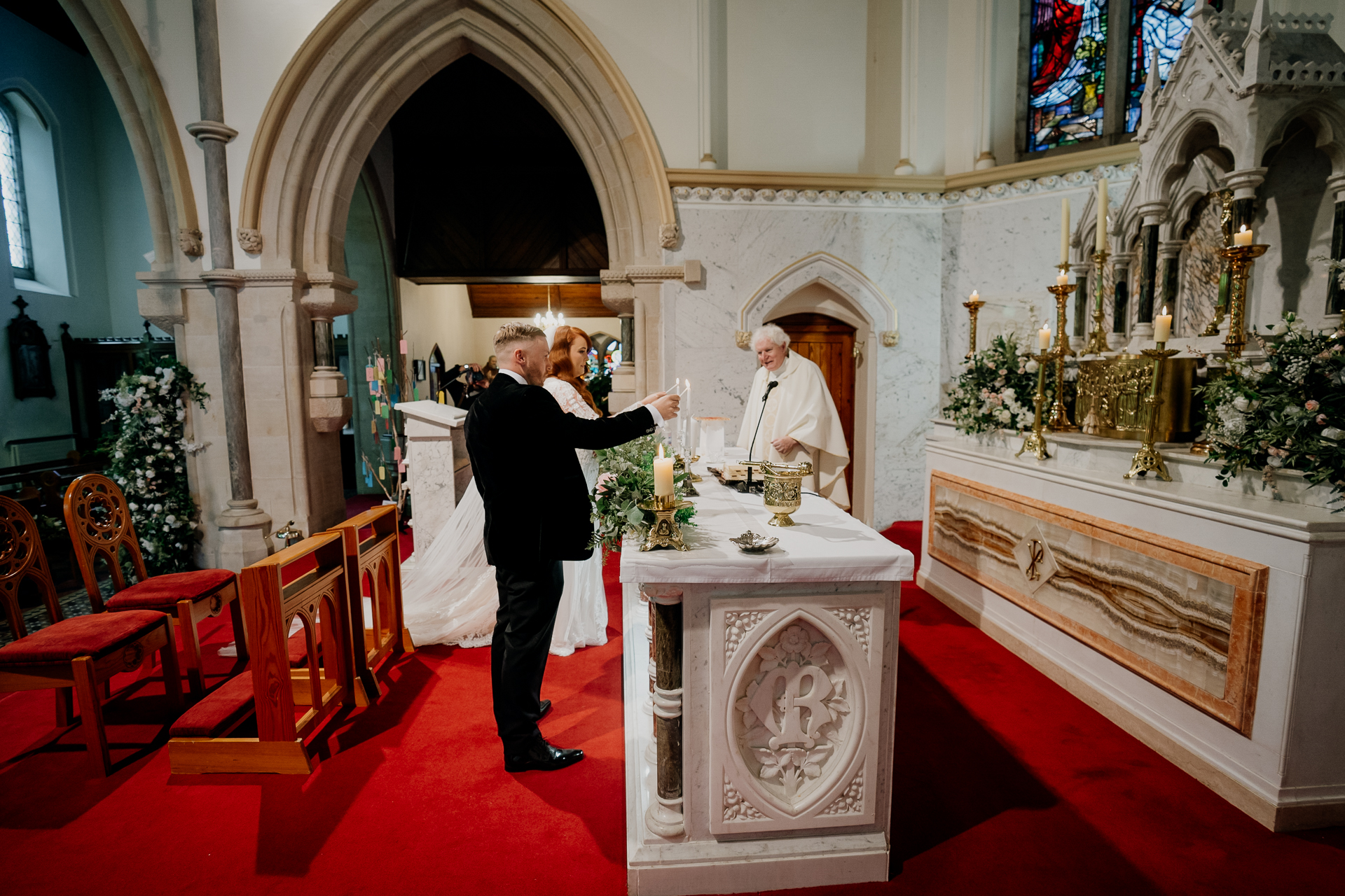 A man and woman kissing in a church