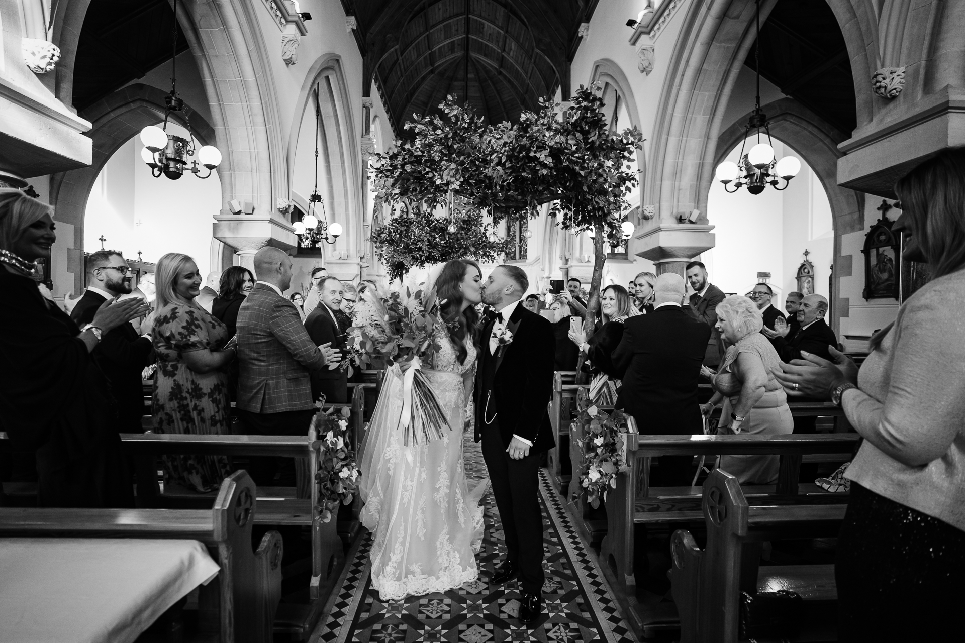 A bride and groom walking down the aisle