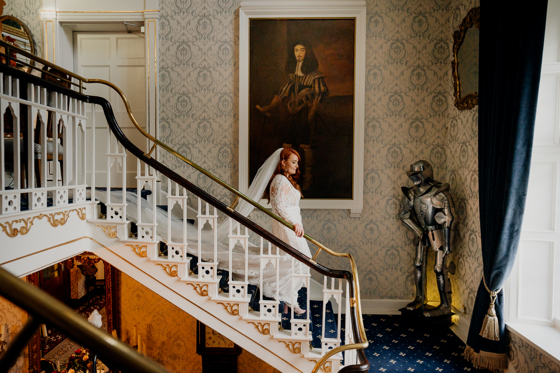 A person in a white dress on a staircase