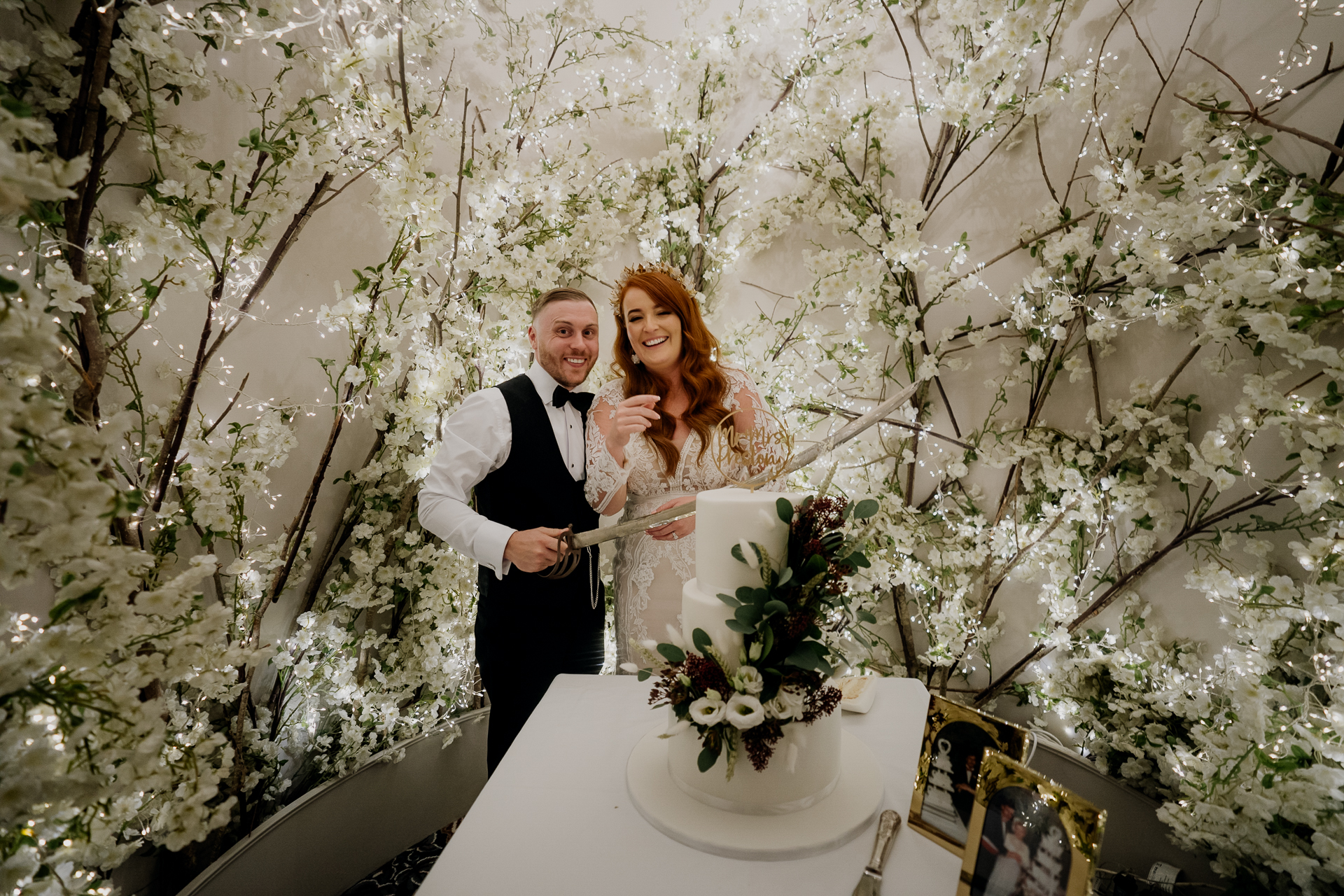 A bride and groom cutting a wedding cake